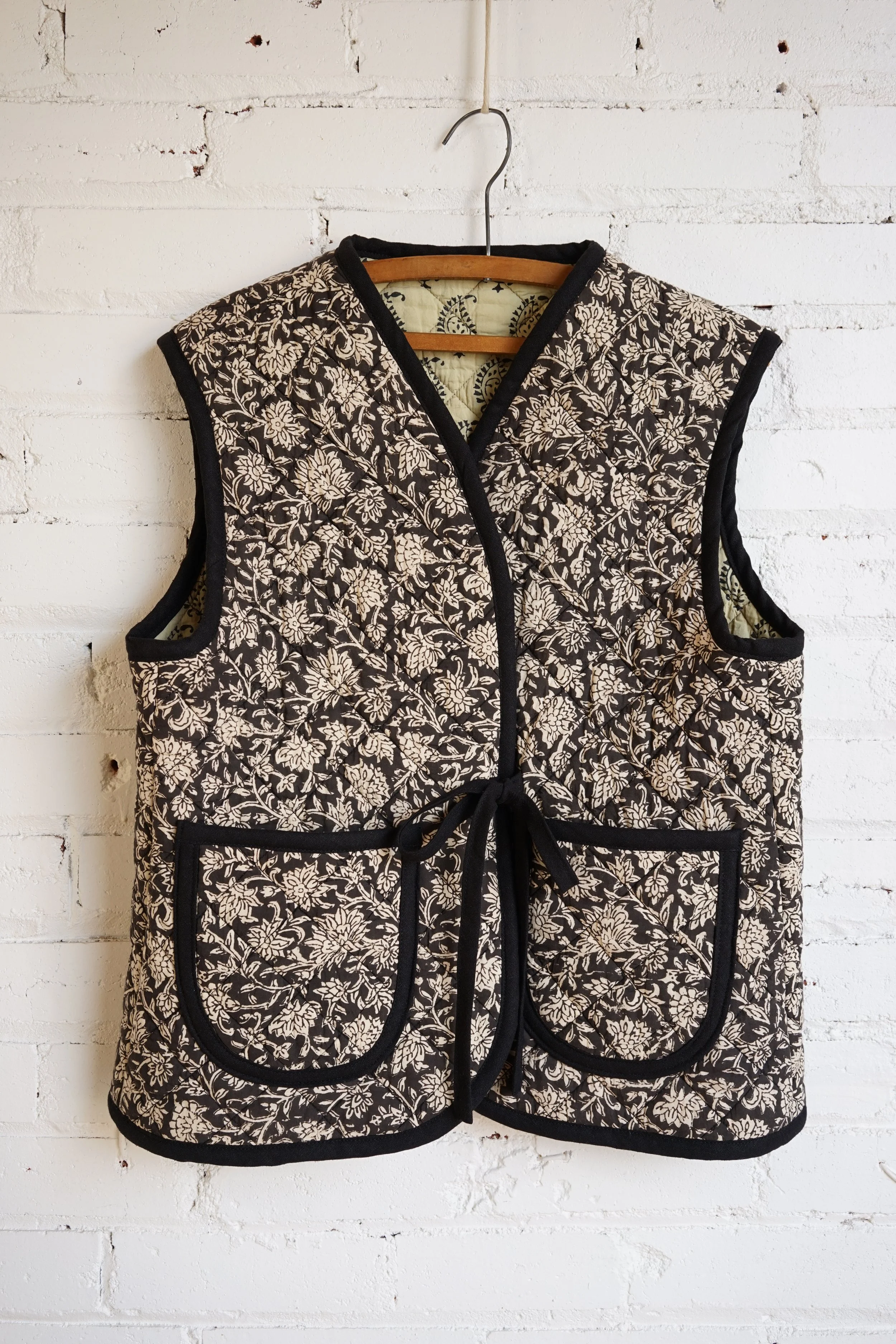Nomad vest sewing pattern — floral block print quilted cotton vest with black bias binding and patch pockets