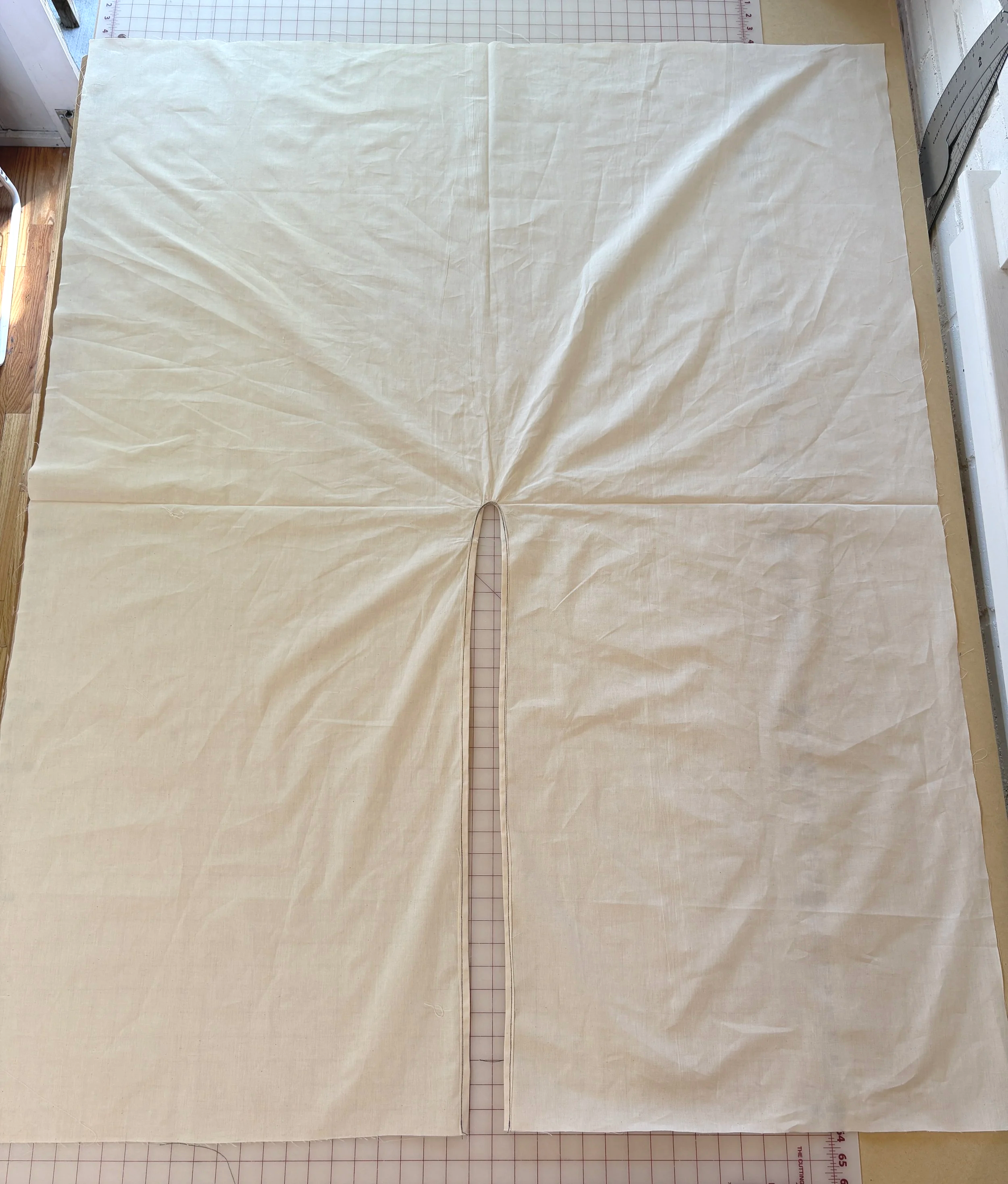 Wrap rectangle laid flat showing the finished, bias-bound front opening down the center
