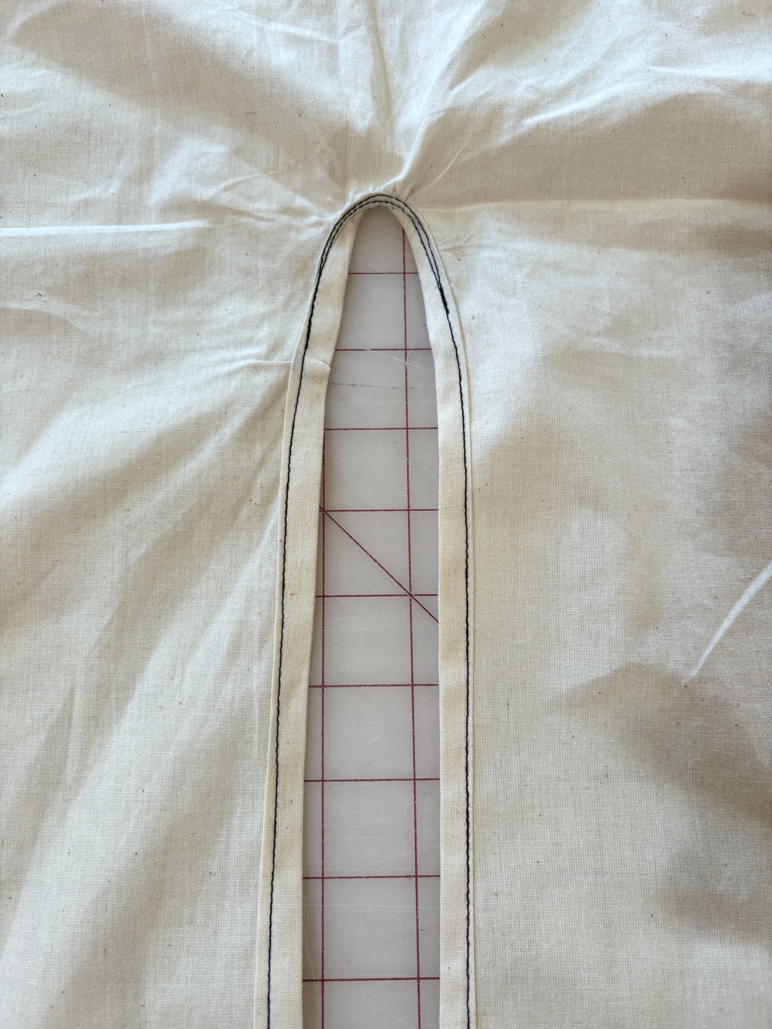 Finished back neck opening with bias binding and double topstitched edge