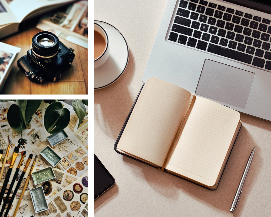 A flat lay of a workspace with a laptop, open notebook, silver pen, mug of coffee, camera, and a collection of vintage stamps and plants.