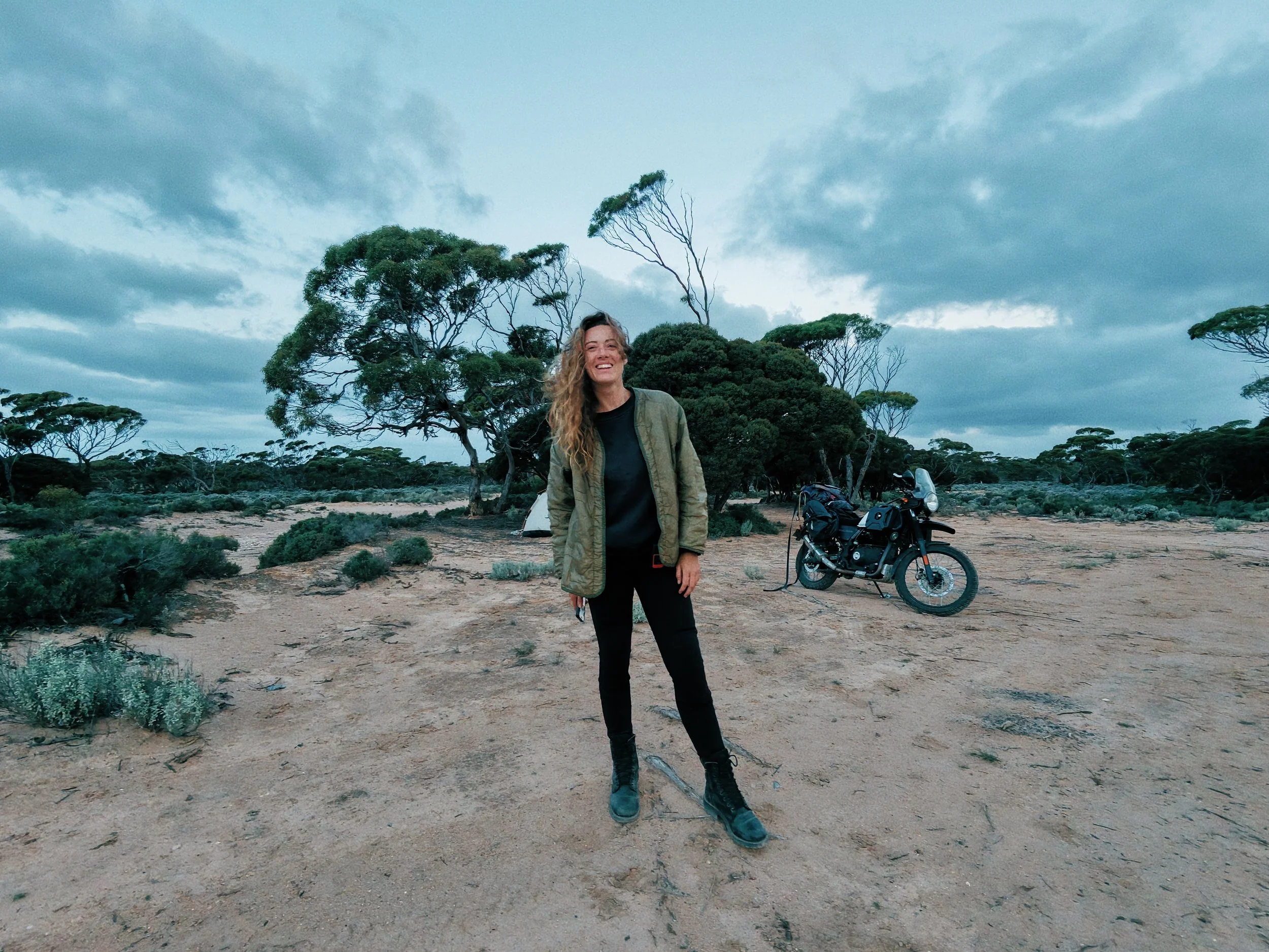 Jasmin Elliott camping with her motorcycle in Australia
