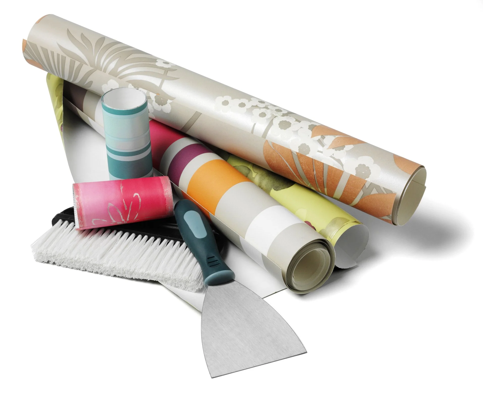 Collection of wallpaper rolls, a wallpaper brush, a putty knife, a tube of adhesive, and a small jar of paint on a white background.