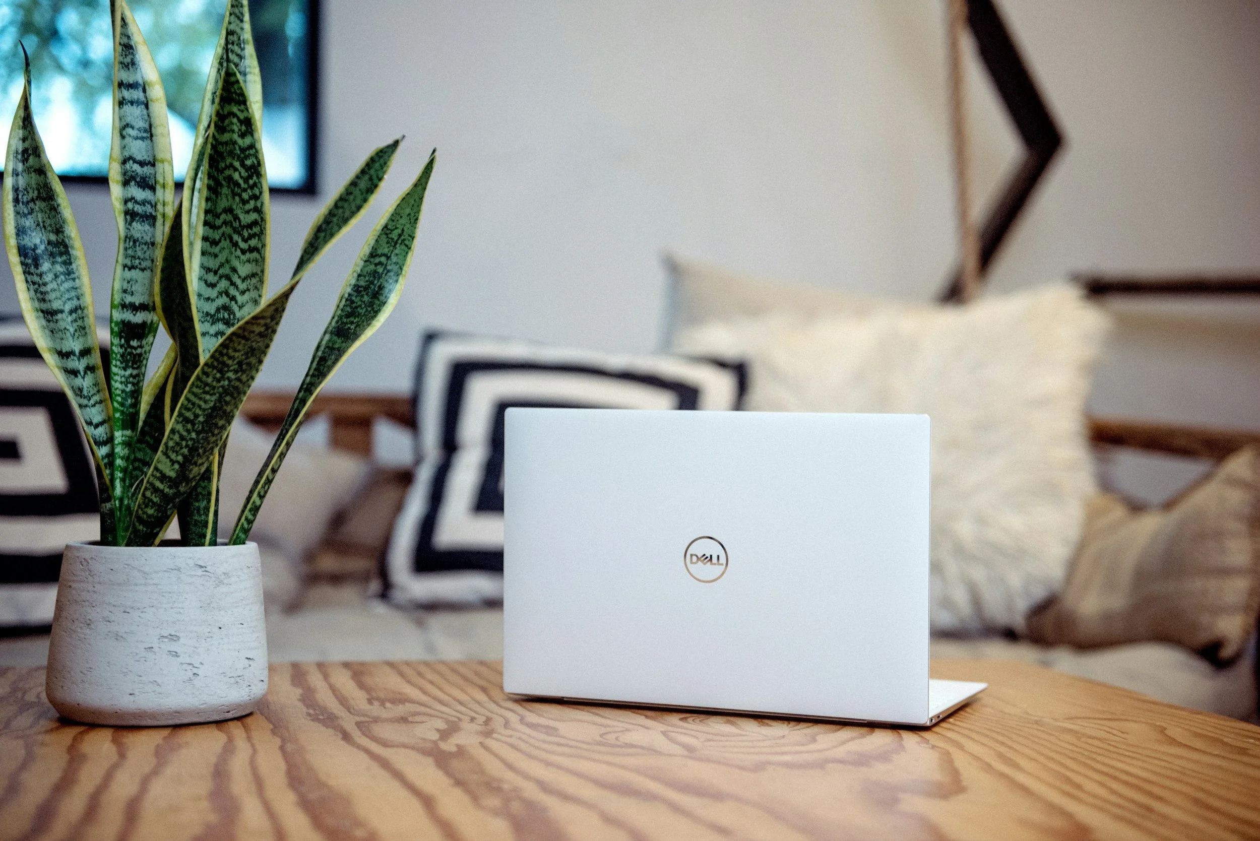 Laptop on a desk in a calm workspace used for building a Squarespace website for therapists