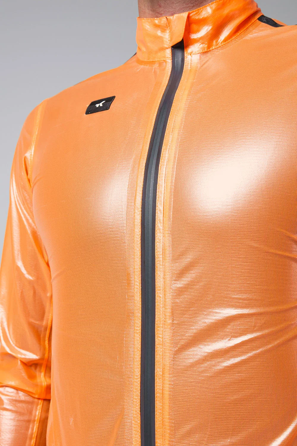 10-05-009-002-lightweight-rain-jacket-pluvia-2-0-unisex-blazing-orange-06_114b0a70-bcc0-47b0-96ab-6fdaa36ea6f7.webp