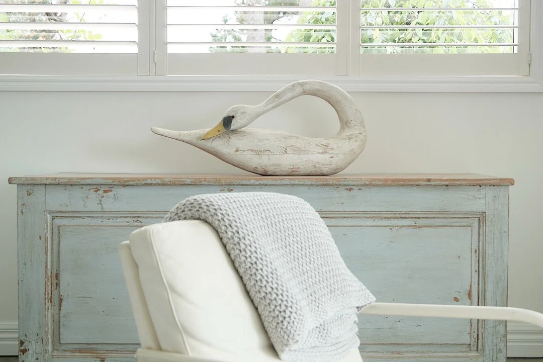 Folk art swan on French haberdashery counter.jpeg