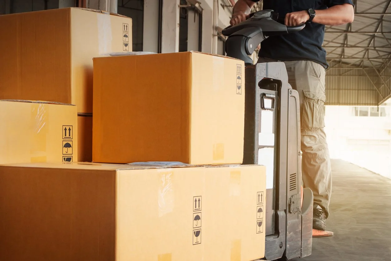 Big boxes being moved in a warehouse - oversized pallet delivery services