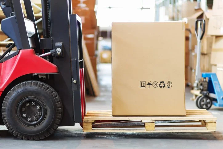 A pallet on a red forklift during an urgent pallet delivery