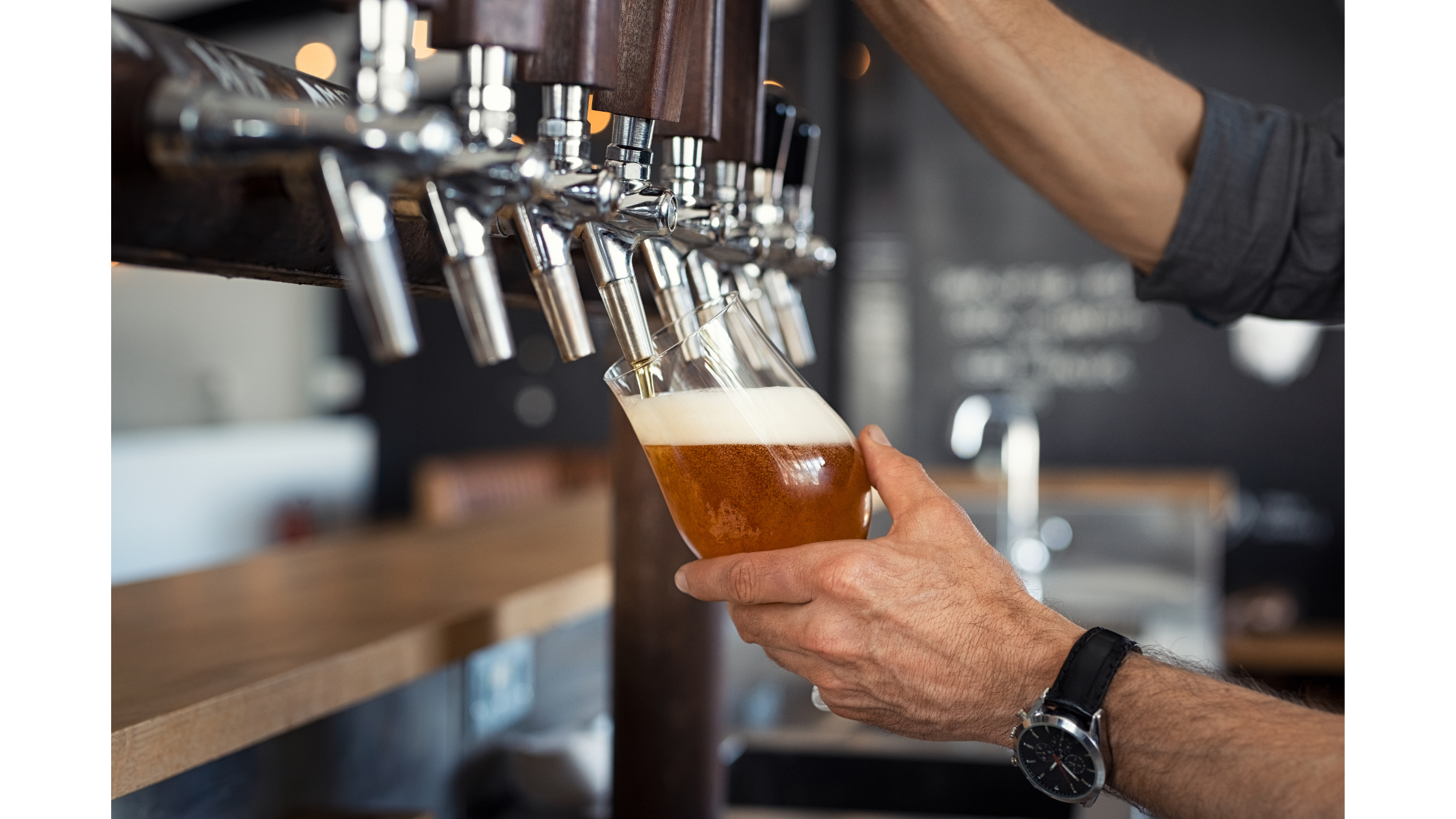 A pint being poured at a bar