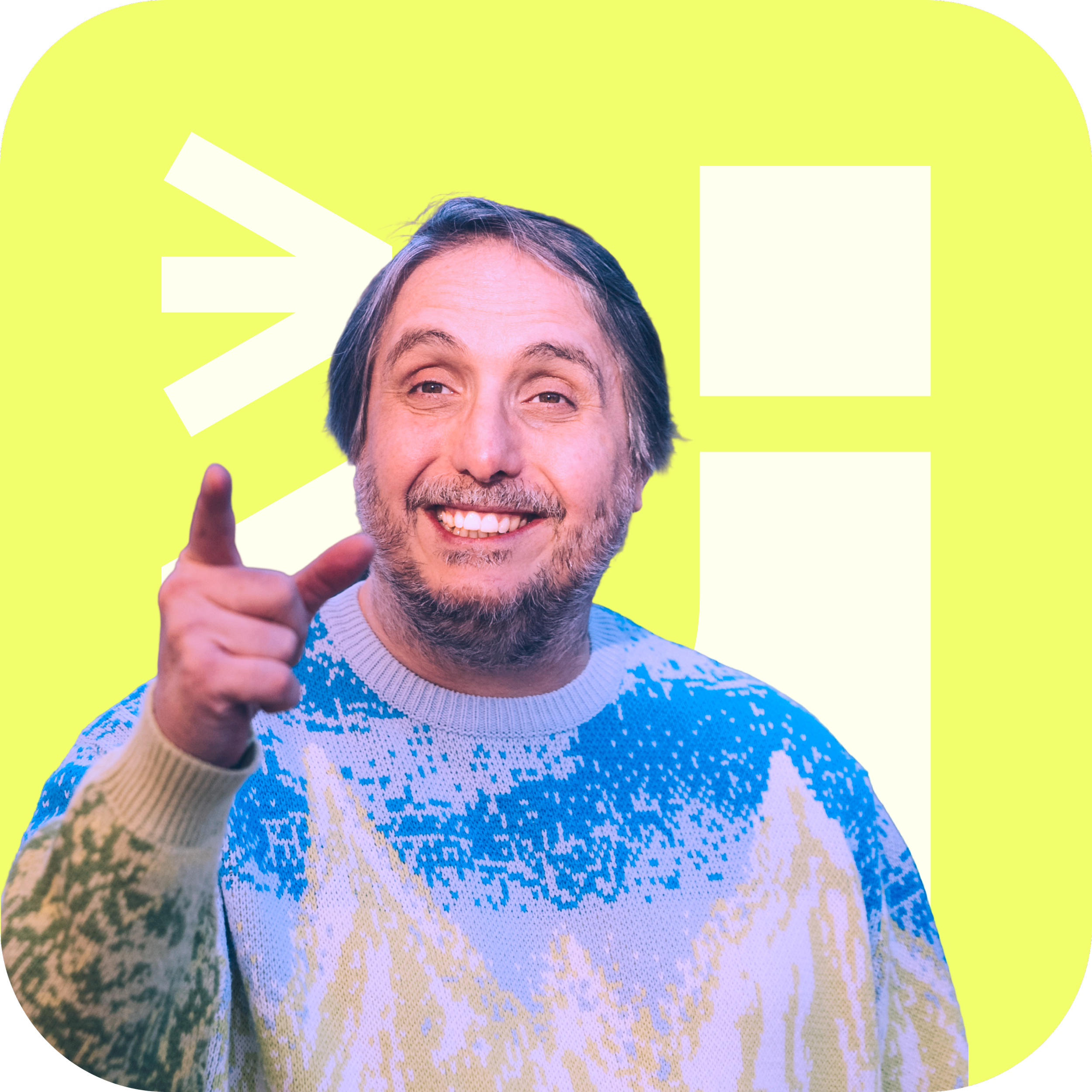 A smiling man with gray hair and a beard wearing a colorful Christmas sweater, pointing with his index finger, standing in front of a bright yellow background with white geometric shapes and exclamation marks.