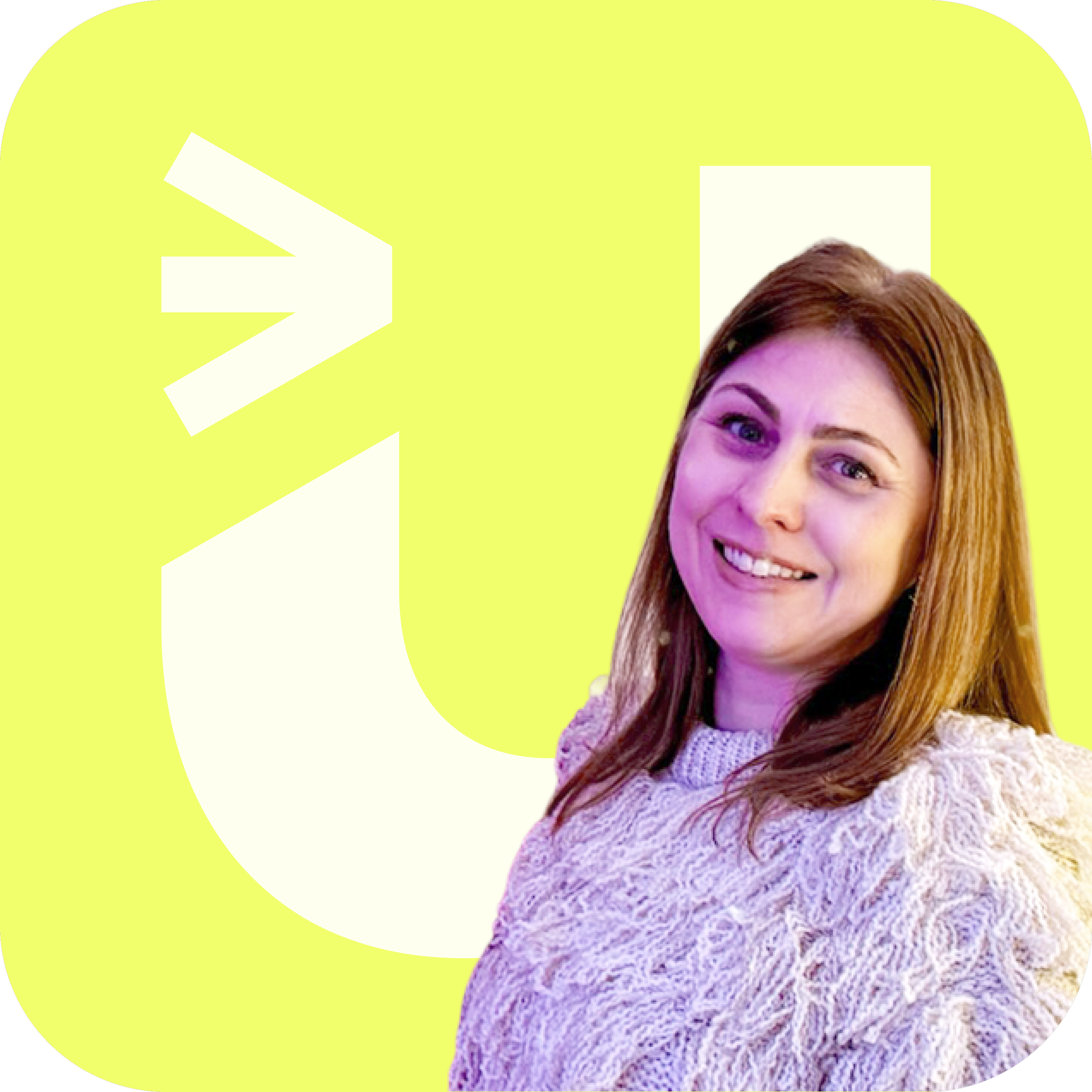 A woman with reddish-brown hair, smiling, wearing a knitted sweater, with a bright yellow background featuring a large white logo and a portrait silhouette.