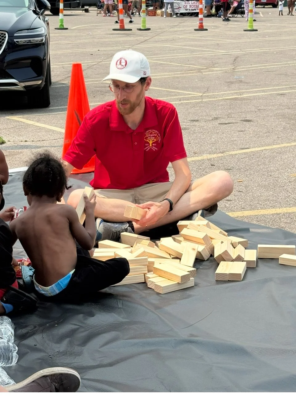 Pastor Josh helping children during Tornado relief in N St Louis.