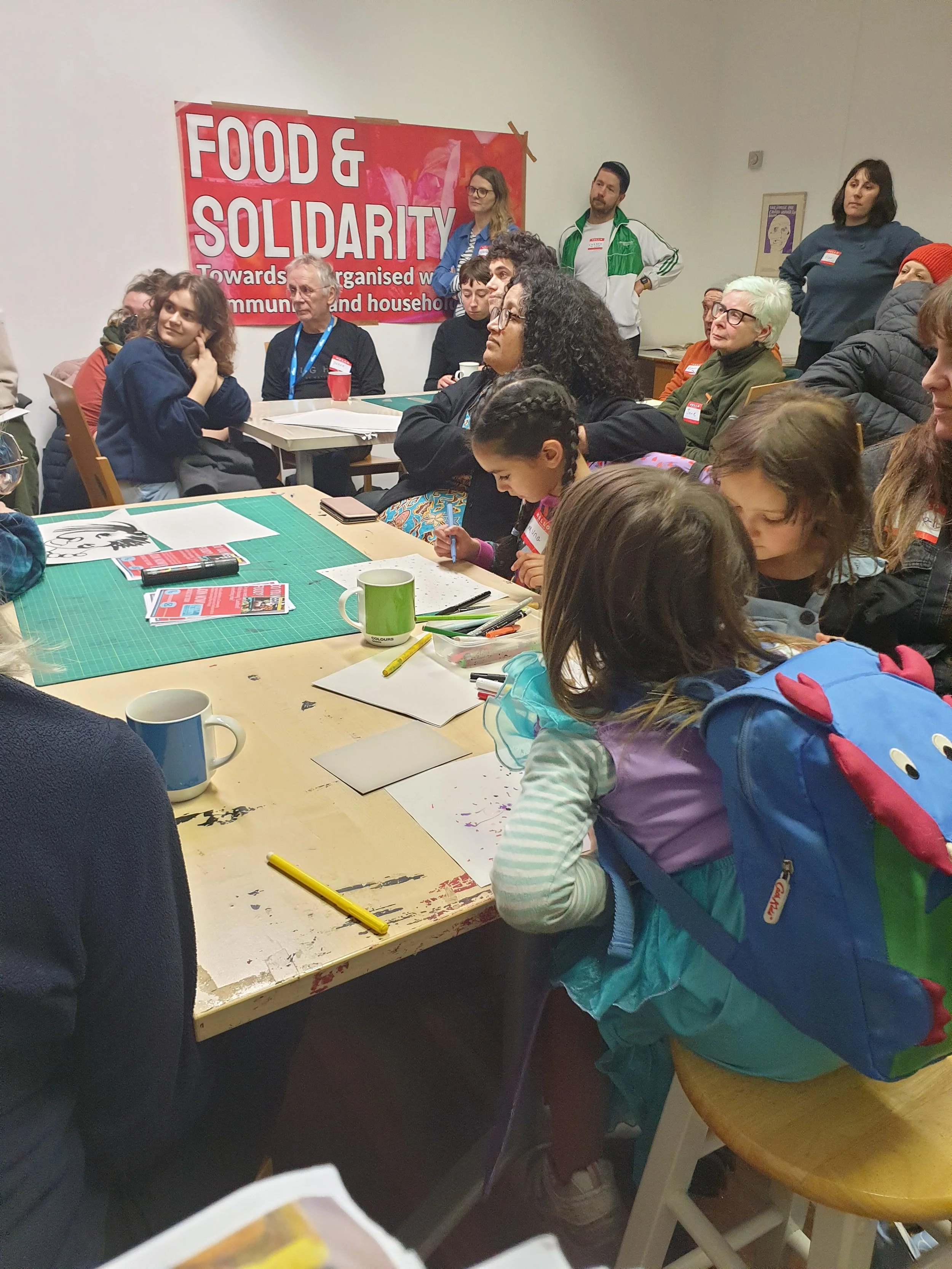 Community housing workshop with renters and kids making protest art, hosted by Food & Solidarity in Newcastle.