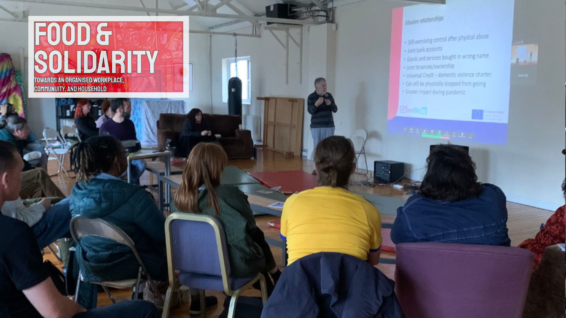 Clean Slate debt advisor explaining debt management strategies at Food and Solidarity community meeting
