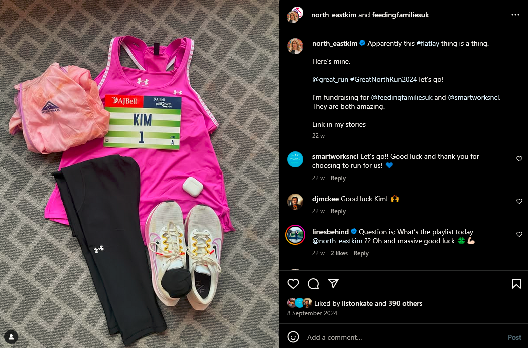 Running gear on a carpet, including a pink tank top with a race bib (KIM 1), black leggings, a pink jacket, white running shoes, black socks, and wireless earbuds. The post mentions fundraising for a food poverty charity at the Great North Run 2024