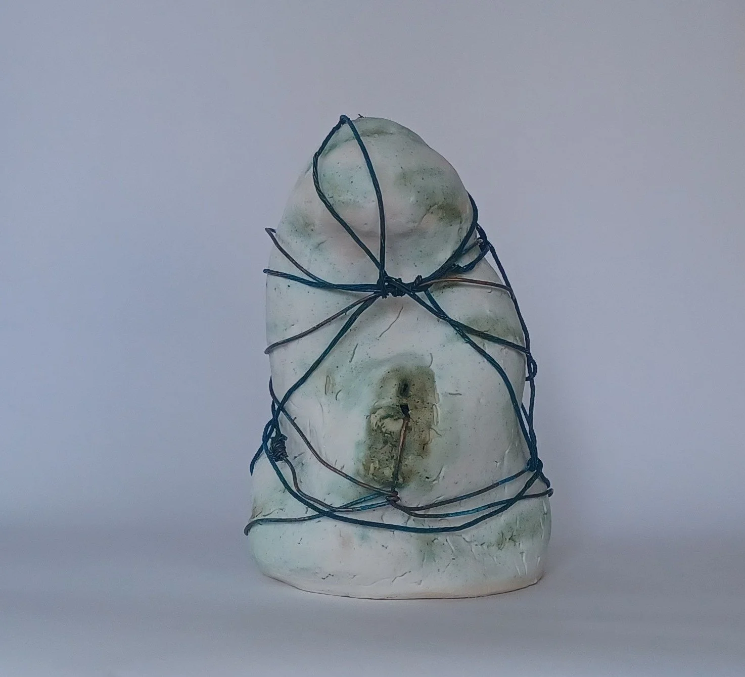 2026. Captive 1.  Porcelain with glaze and copper wire. 10 X 7.5 X 8 Inch (25.4 x 19 x 20.32 cm)