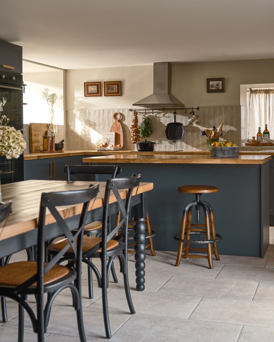 A country kitchen for beautiful gatherings with friends and family. The island opens to the made to measure, solid wood table, This inviting space is the heart of the house. 

📸 @studio.maple 

 #kitchendesign #farmhousedecor #farmhousestyle #countr