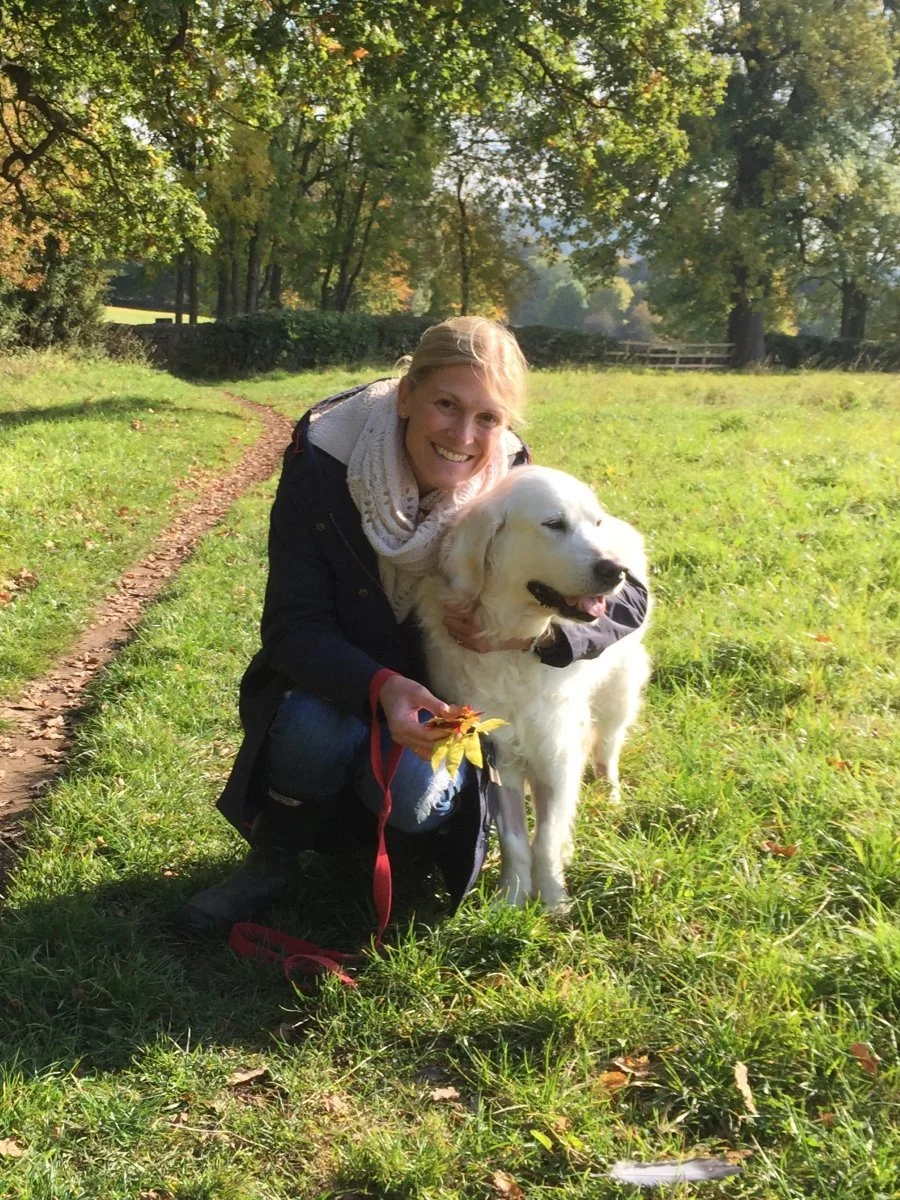 Anna Cockle, Veterinarian and business owner hugging dog