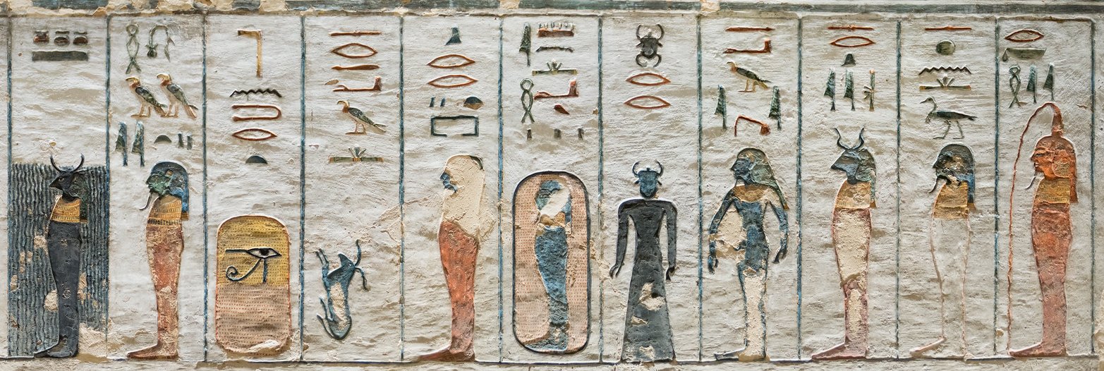 Ancient Egyptian painted relief showing forms of the god Re, each in a rectangle with a hieroglyphic label above.