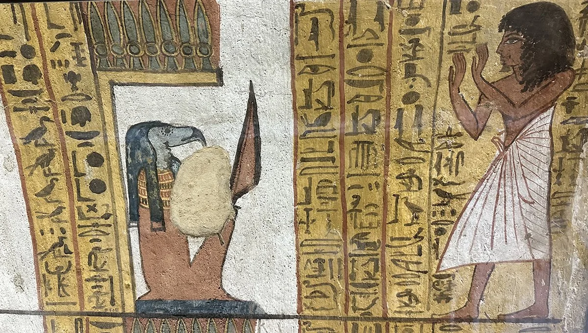 Ancient Egyptian painting with a bird-headed demon holding a knife being worshipped by a man in kilt.