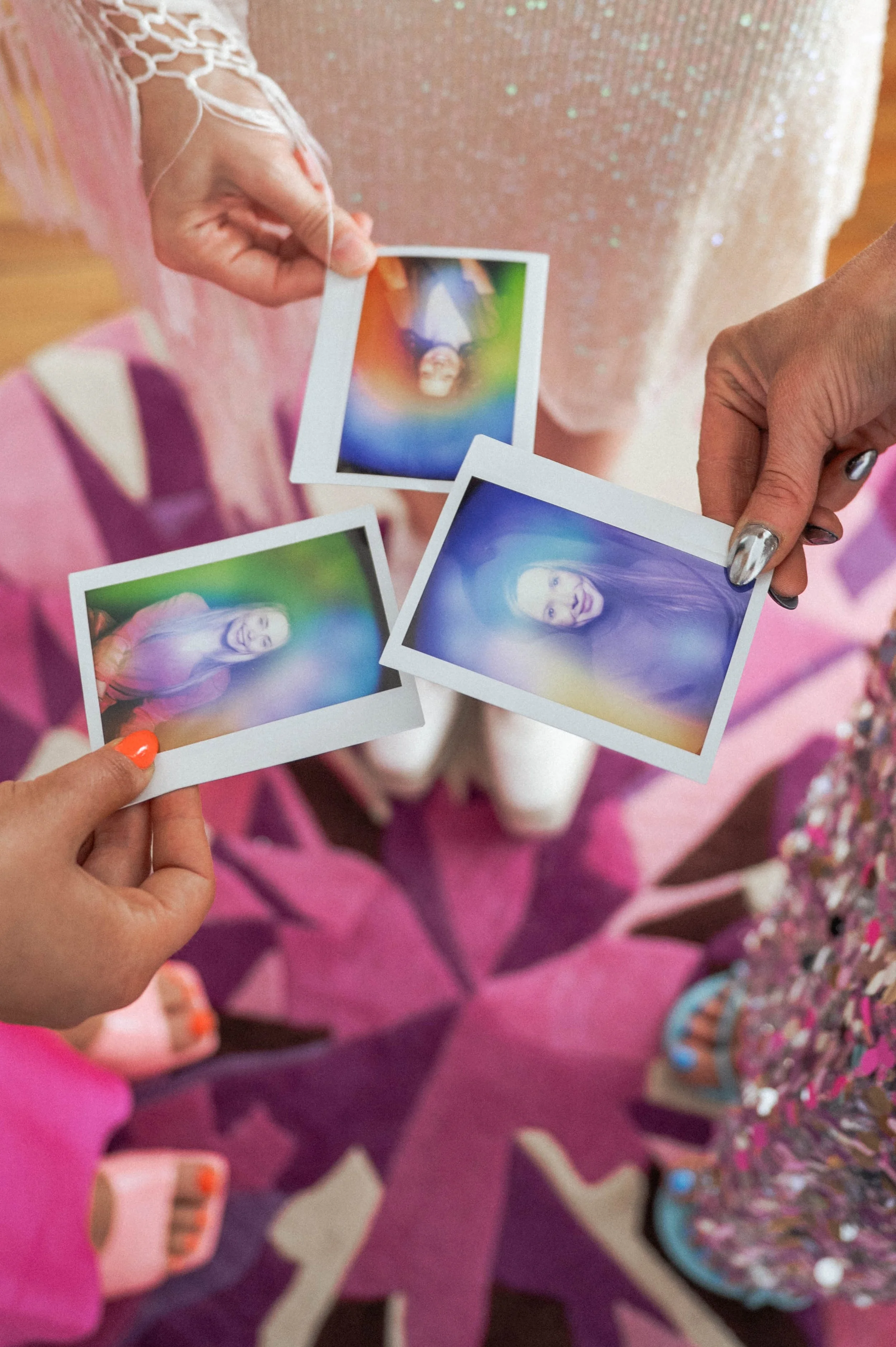 three women holding their aura photos that they had taken at Soulshine Aura near Washington DC