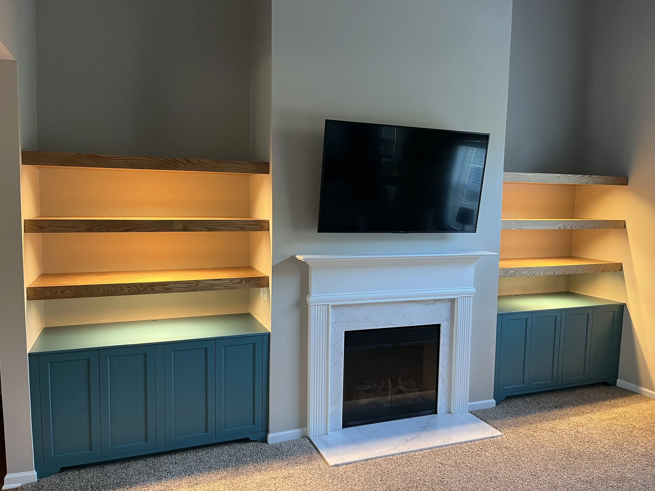 Custom shelves, custom cabinets, built in lights after 2.JPG