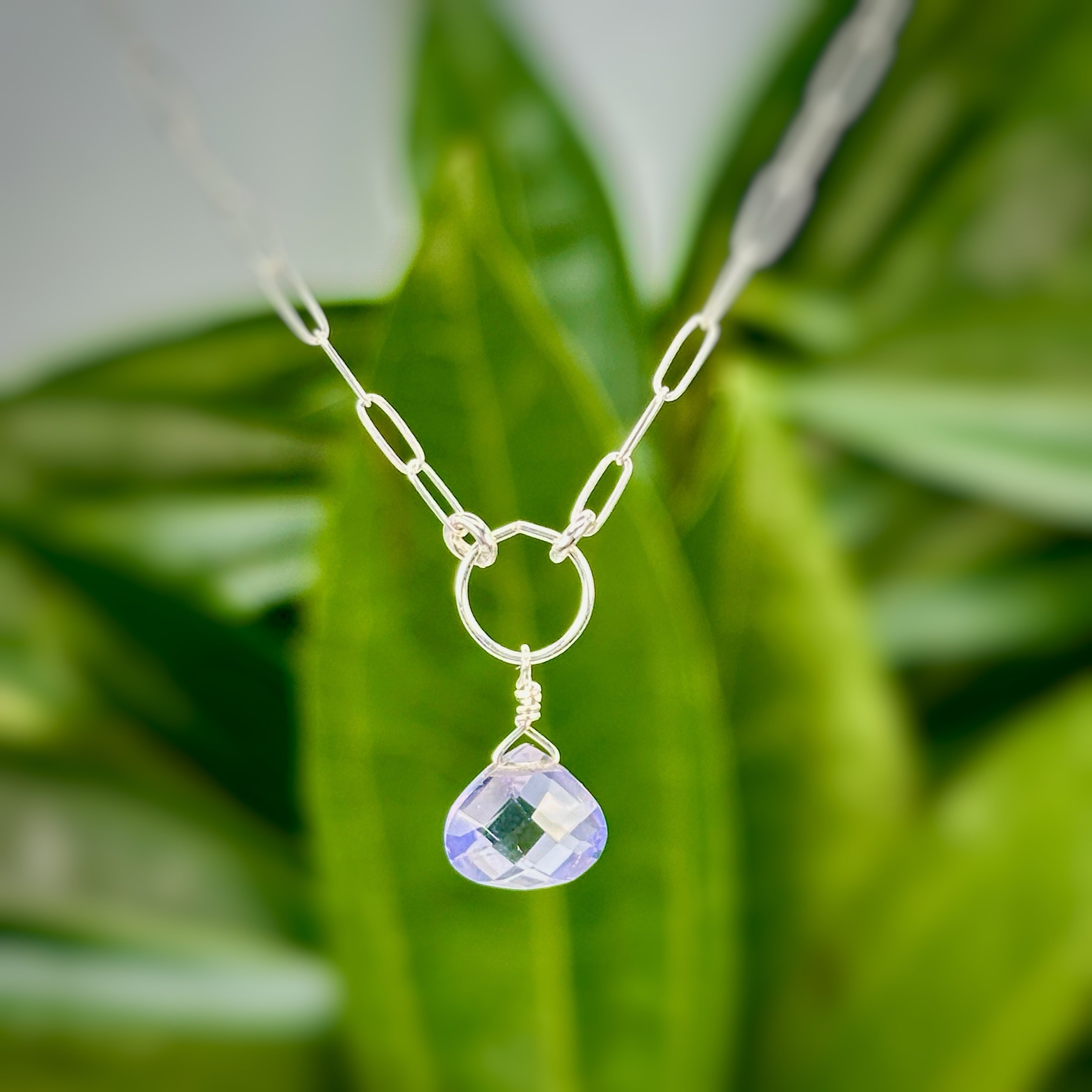 🌸The Peony necklace! BRAND NEW!

This little beauty centerpiece is blue iolite, which really looks more lavender doesn't it? Paired with sterling silver to pop the brightness, this necklace is delicate and simple for a simple everyday necklace or ne