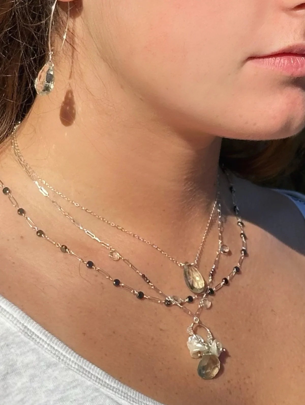 Three power-player necklaces on Maddy.

A faceted green amethyst Peony, a Studio Series pyrite + pearl + green amethyst, and a chain link with hematite rounds every other.

Metals, pearls, and soft greens&hellip;
yeah, that&rsquo;s the bomb. 💥✨

#ab