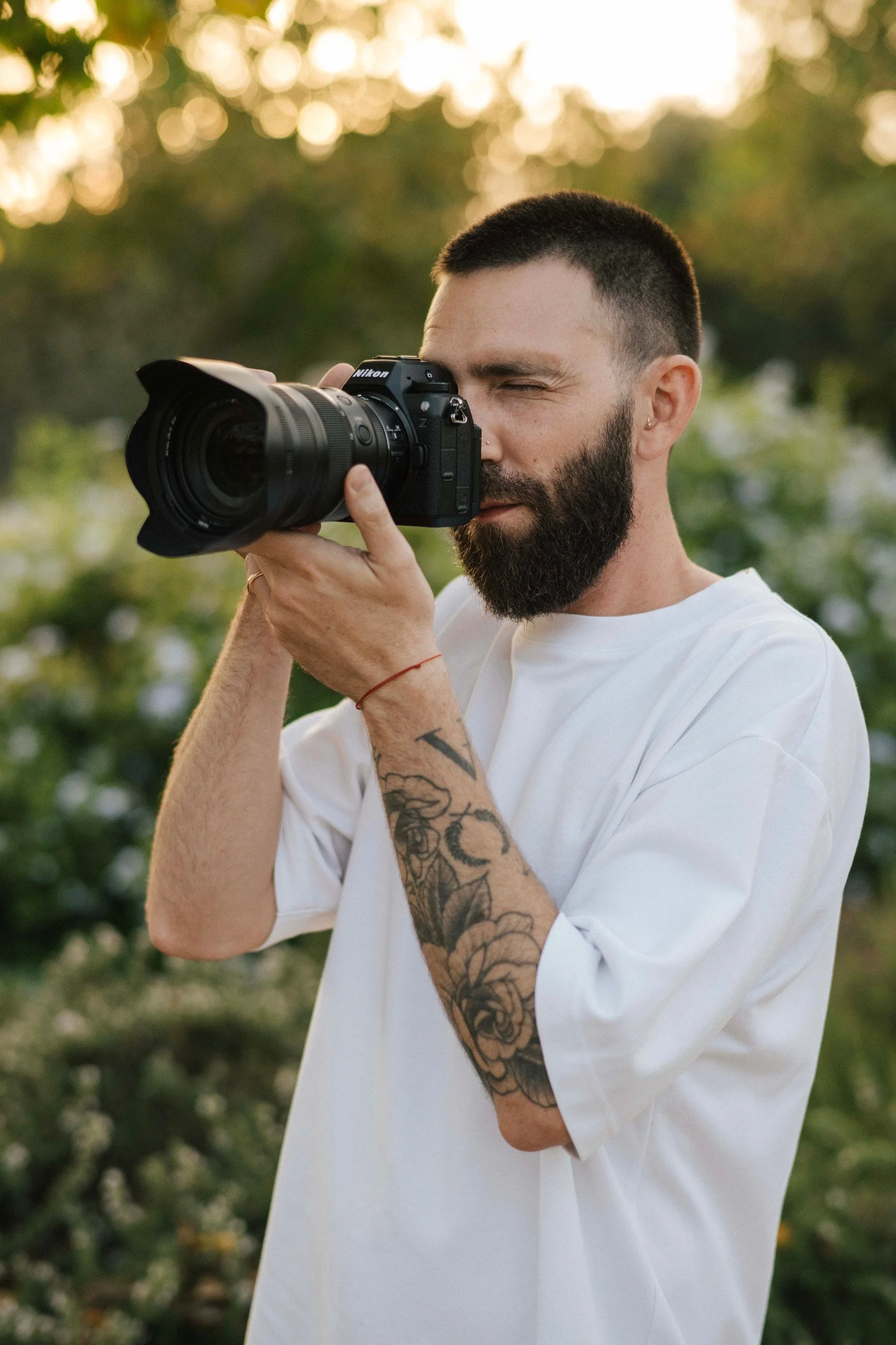 Tomer Vitebsky, France-based architecture and hospitality photographer, holding a camera on location