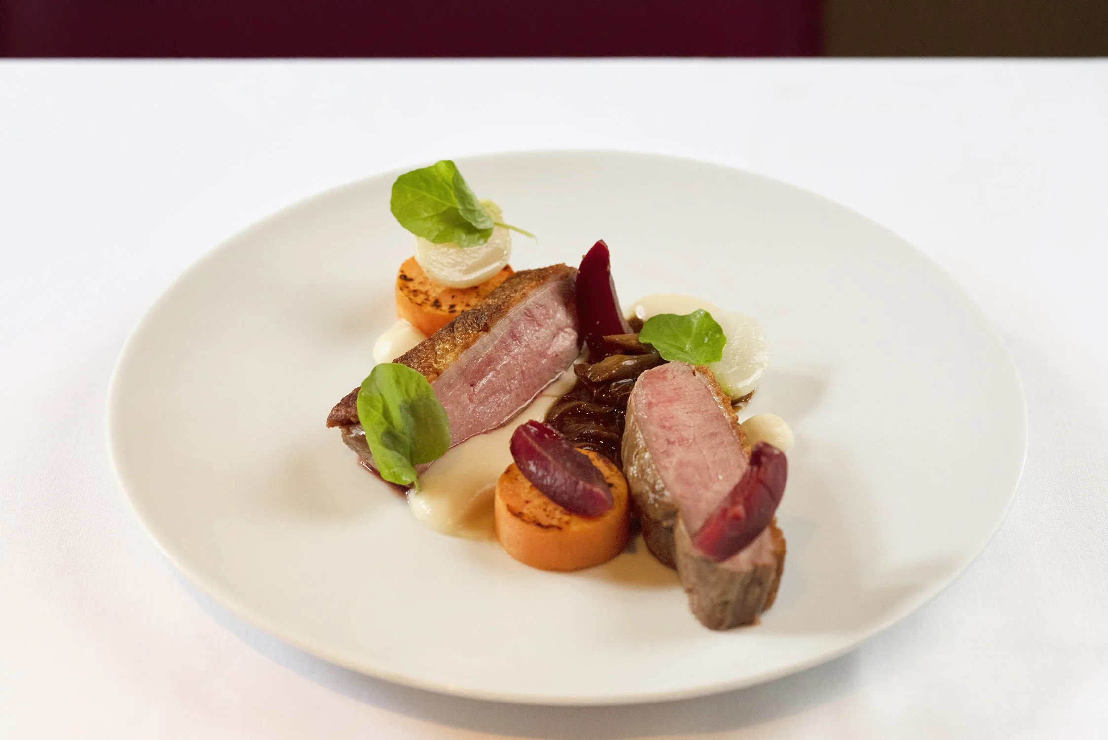 02-fine-dining-duck-breast-beet-greens-white-plate.jpg