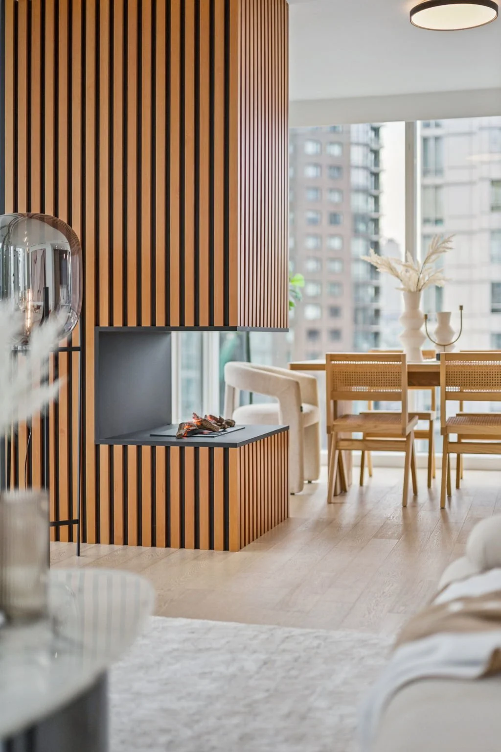 yaletown-home-wood-slat-fireplace-dining-room.jpg
