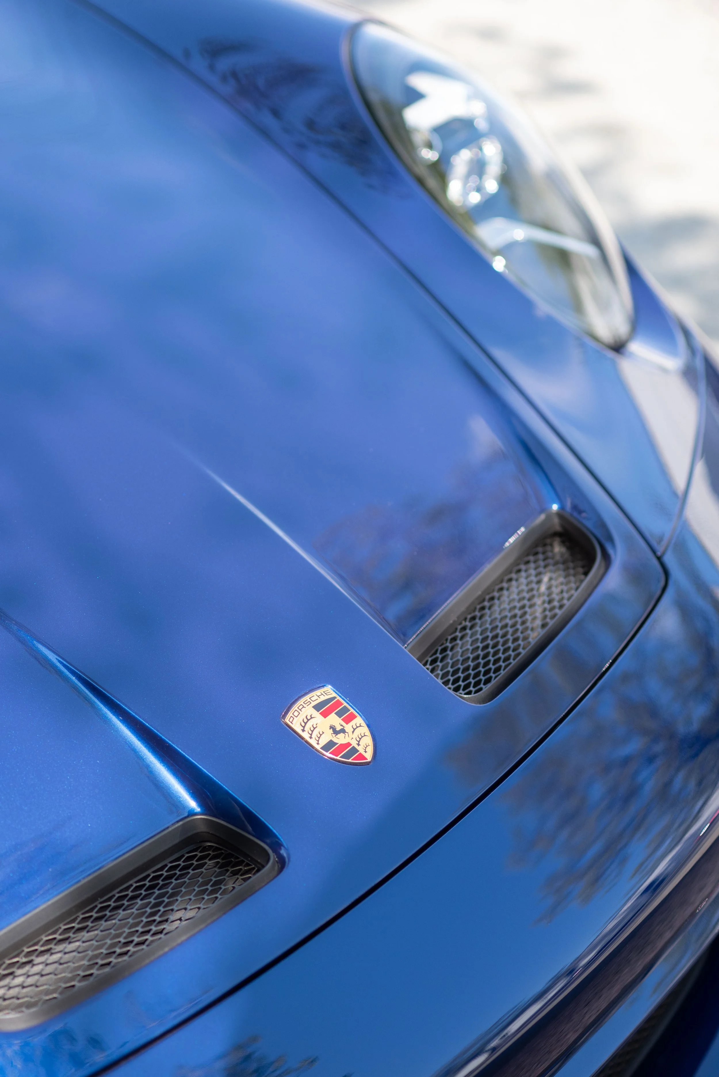 05-porsche-blue-hood-crest-detail-vancouver.jpg