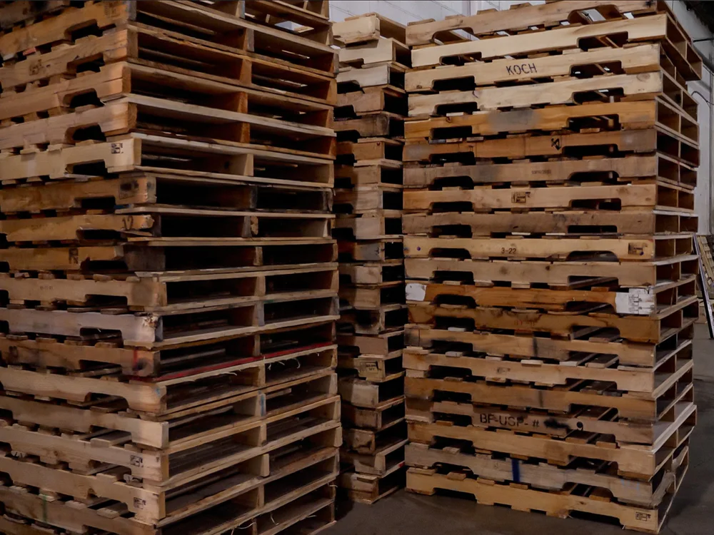 Stacks of refurbished wood pallets sorted for grading at the Rochester yard