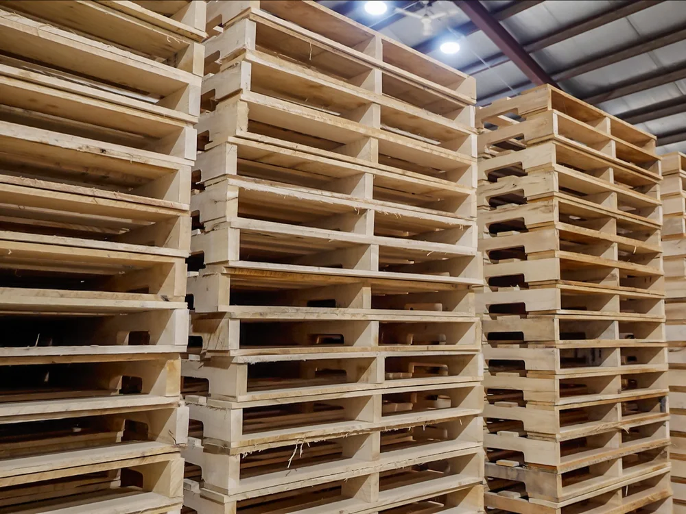 Stacks of new hardwood pallets in the Rochester Pallets warehouse