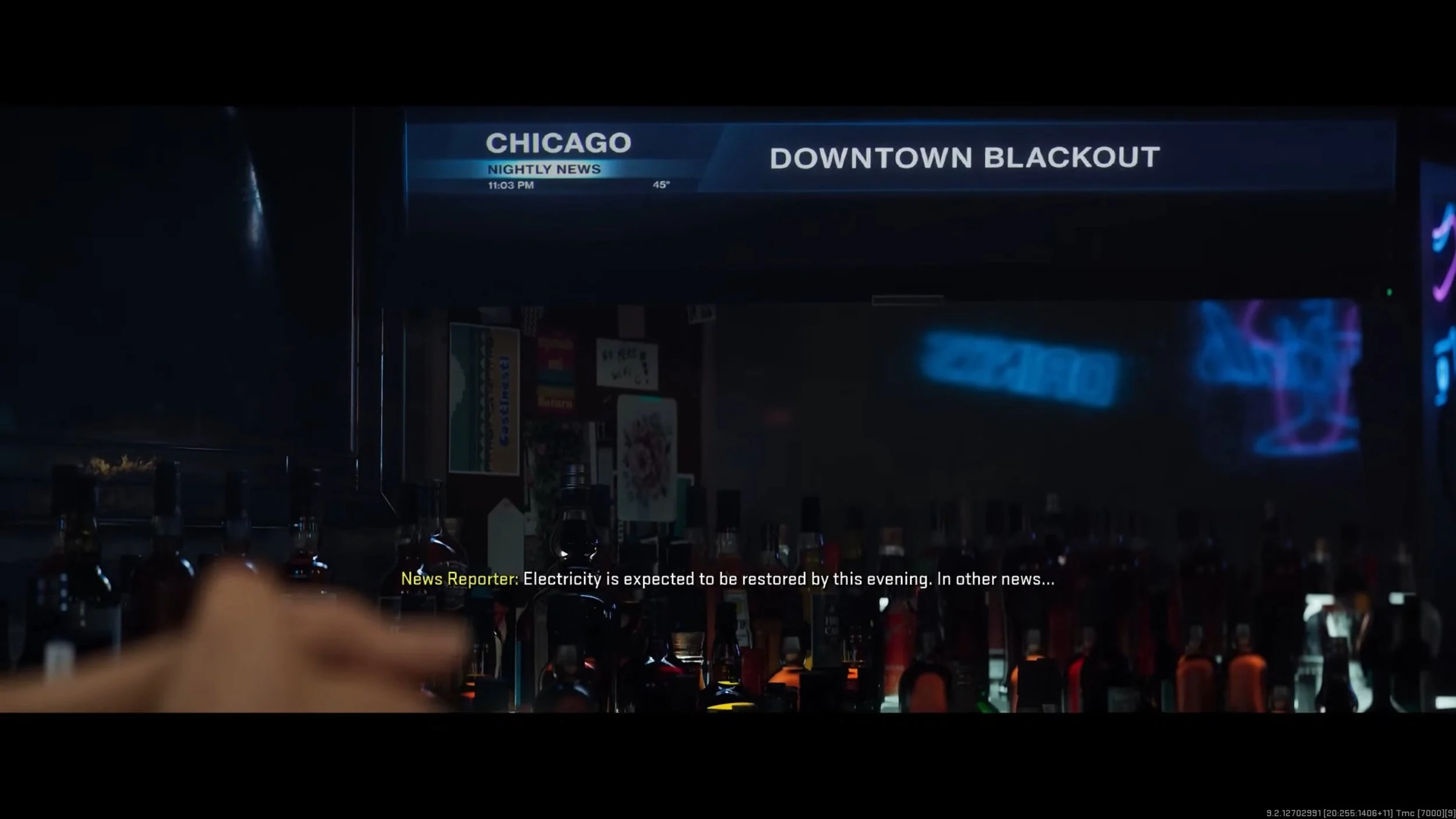 Television screen showing news about Chicago blackout at 11:03 PM with a temperature of 45°F, bar with bottles below, and a scrolling news ticker at the bottom.