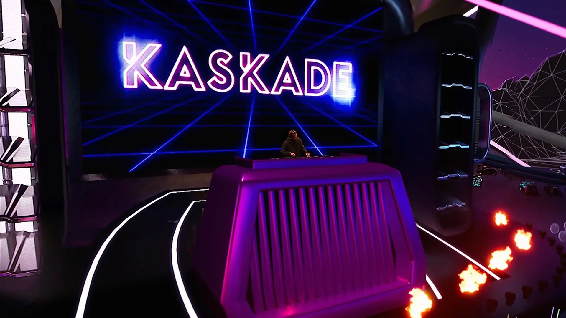 A person in a dark hoodie DJing on a stage with a large neon sign that reads 'KASKADE' in bright purple and pink lights, with retro futuristic graphics and glowing lines in the background.