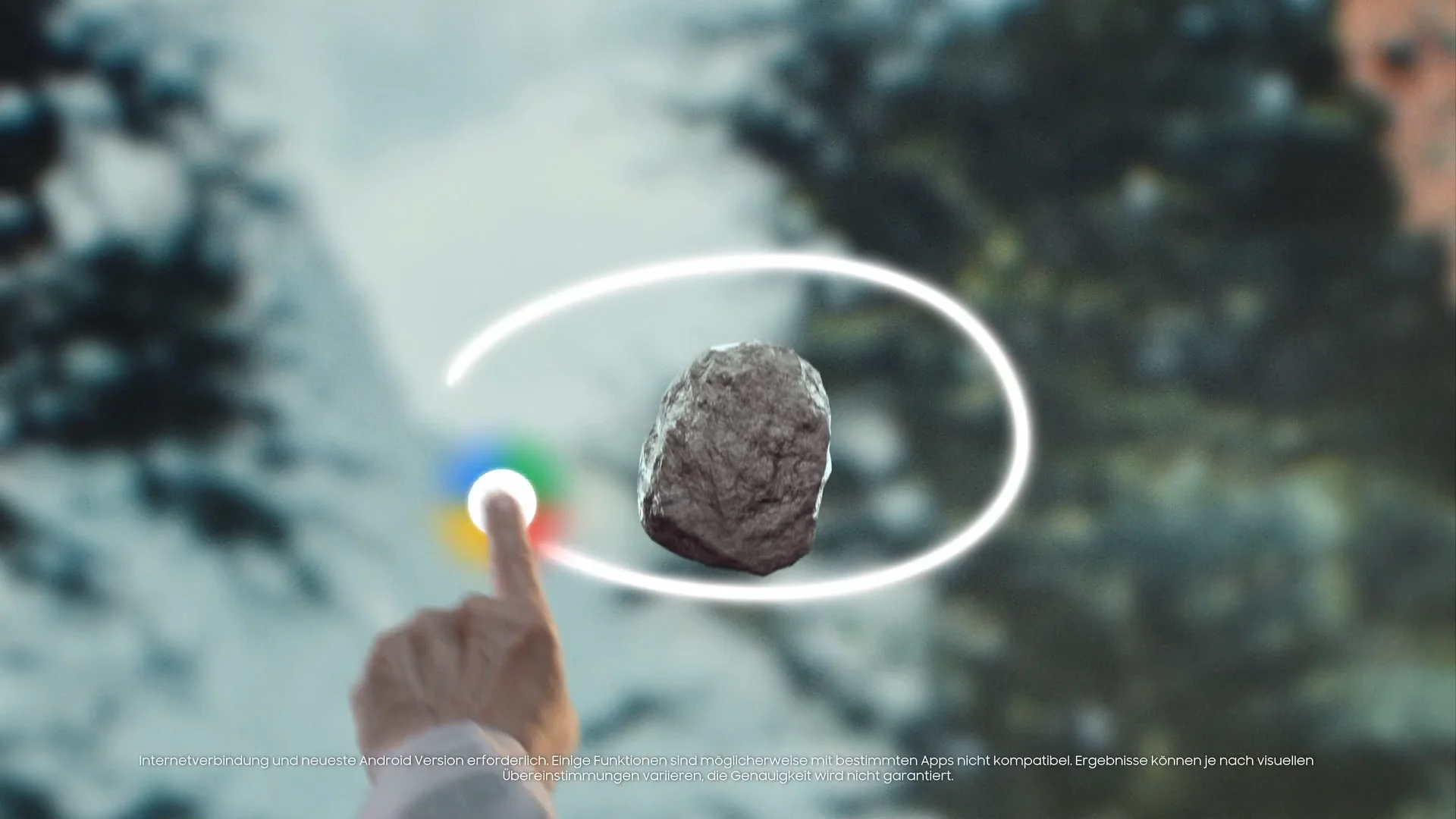 A person points at a floating rock with a holographic ring around it, in a forest scene.