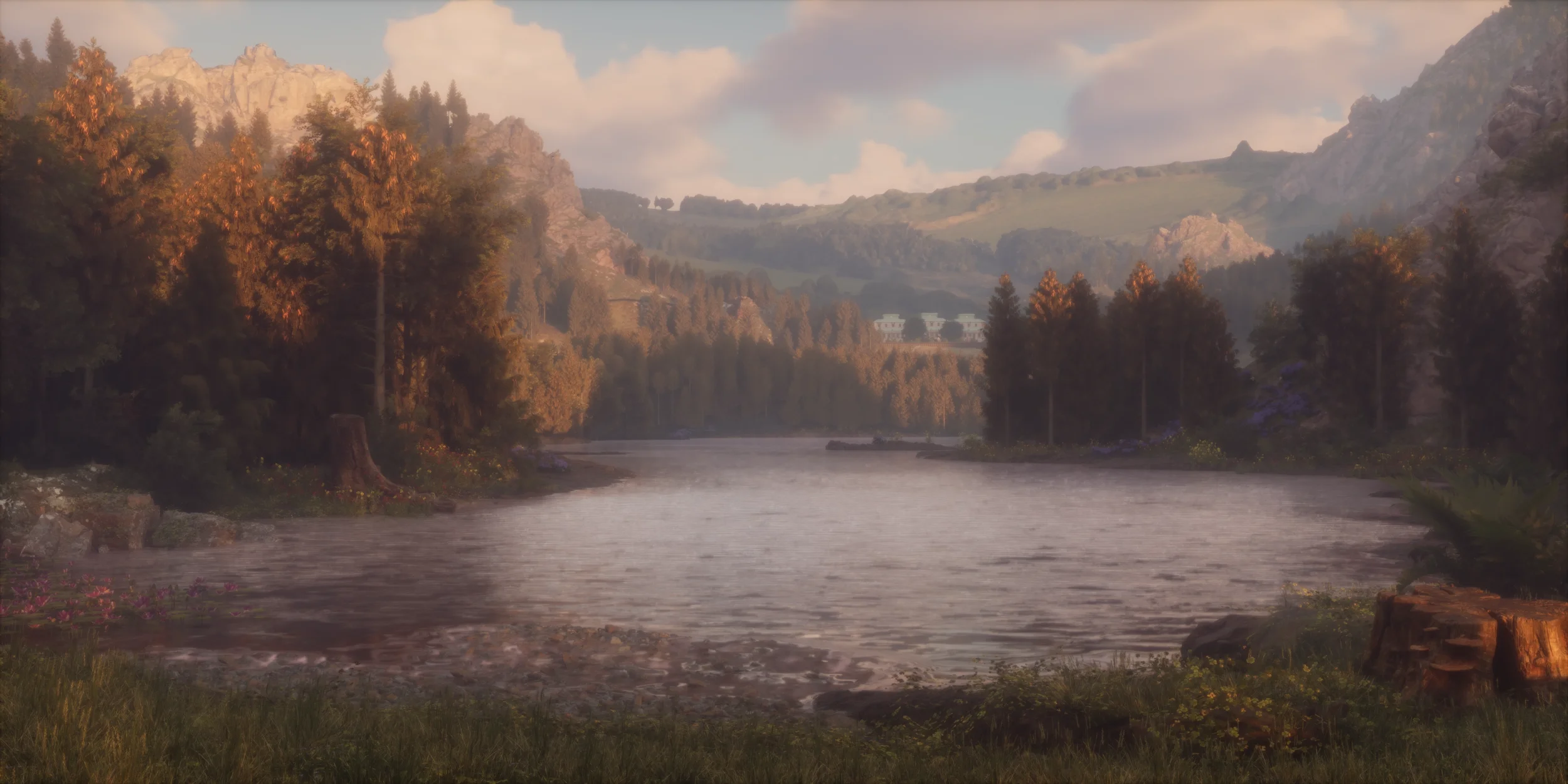 A scenic landscape with a river flowing through a forested valley, surrounded by mountains under a partly cloudy sky.