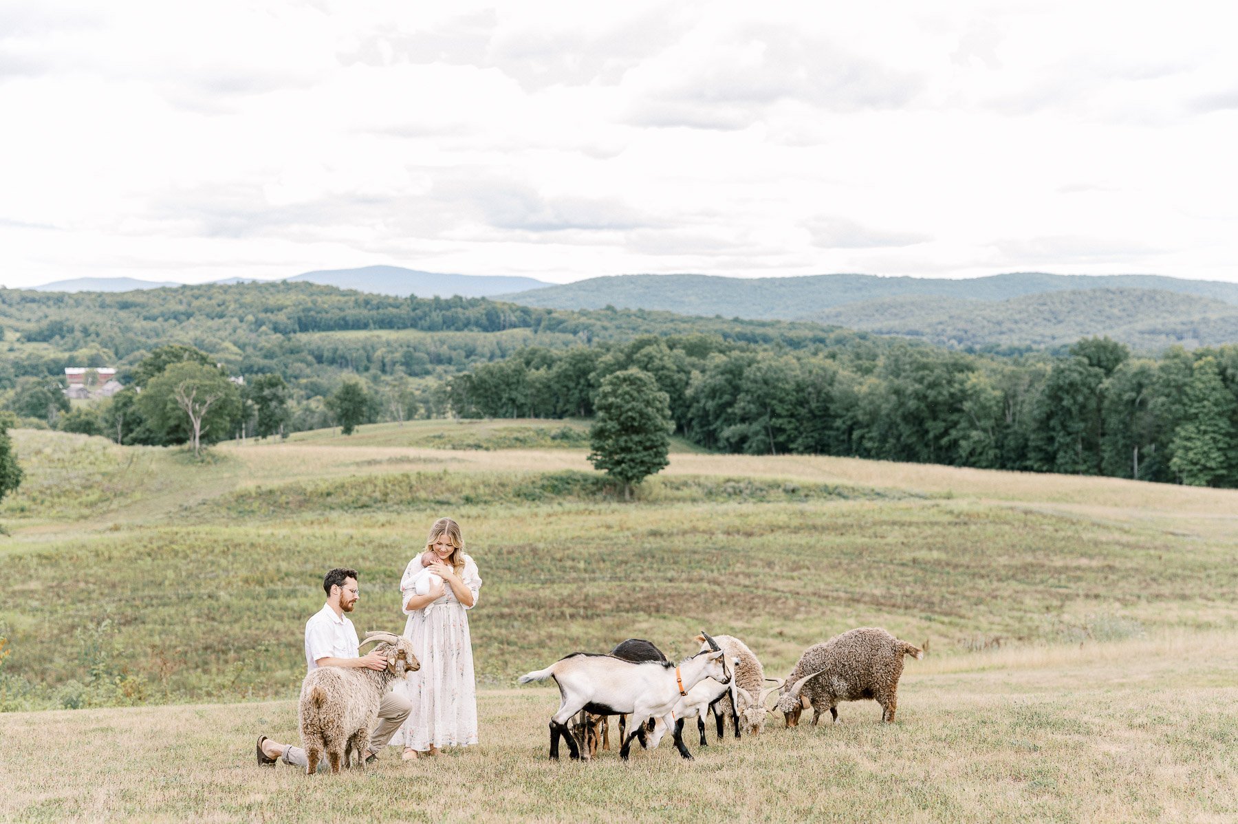 Upstate NY family and newborn photographer at family farm with goats