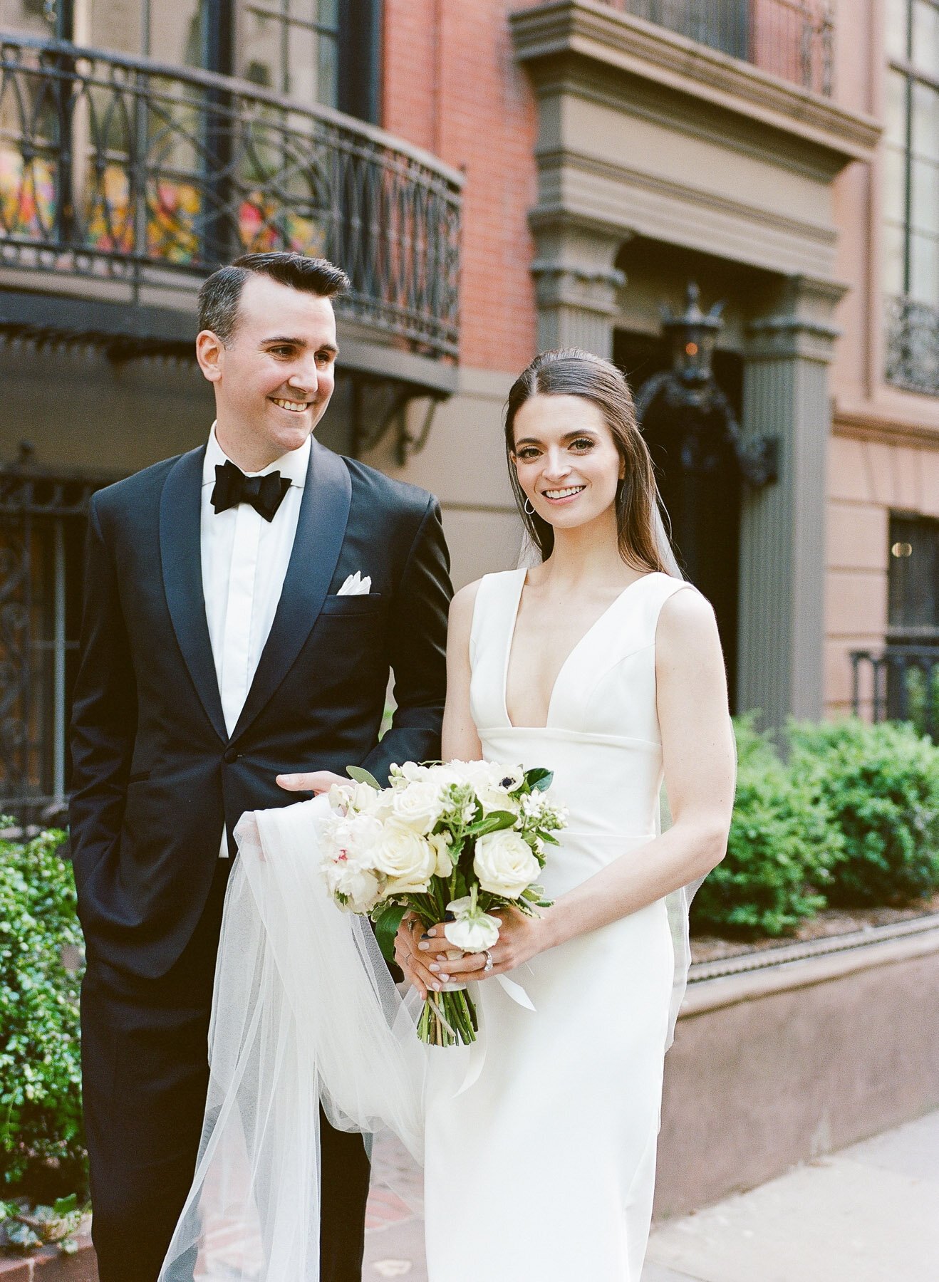 Gramercy Park wedding photos featuring Sarah Seven wedding dress and Tom James Tux