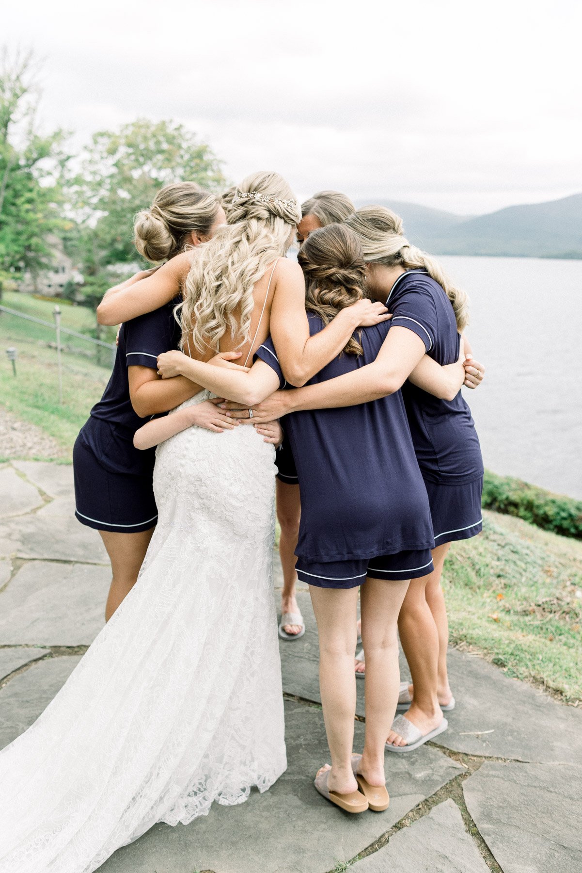 Bride hugs bridesmaids