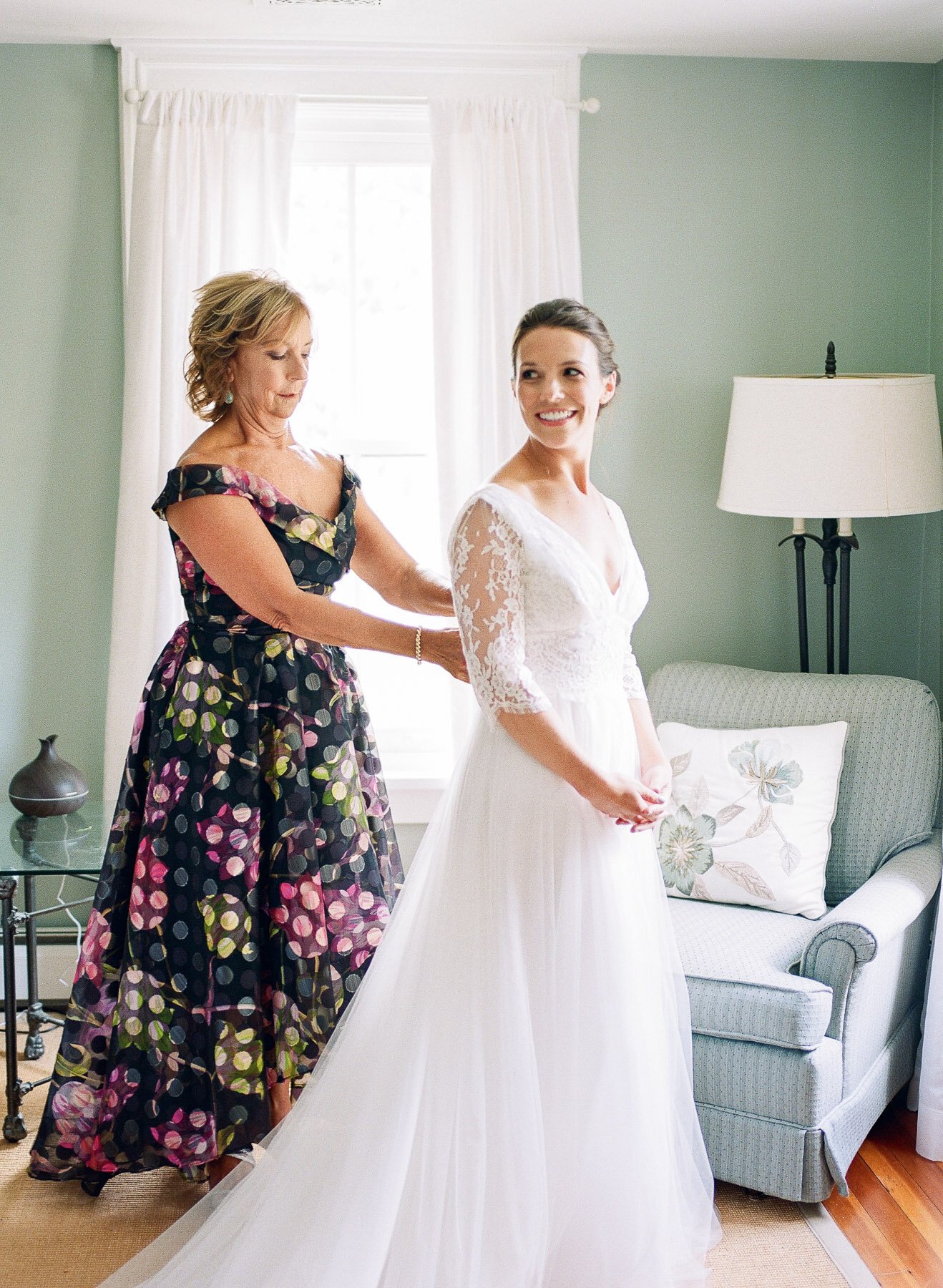 Mother of bride and bride getting dressed