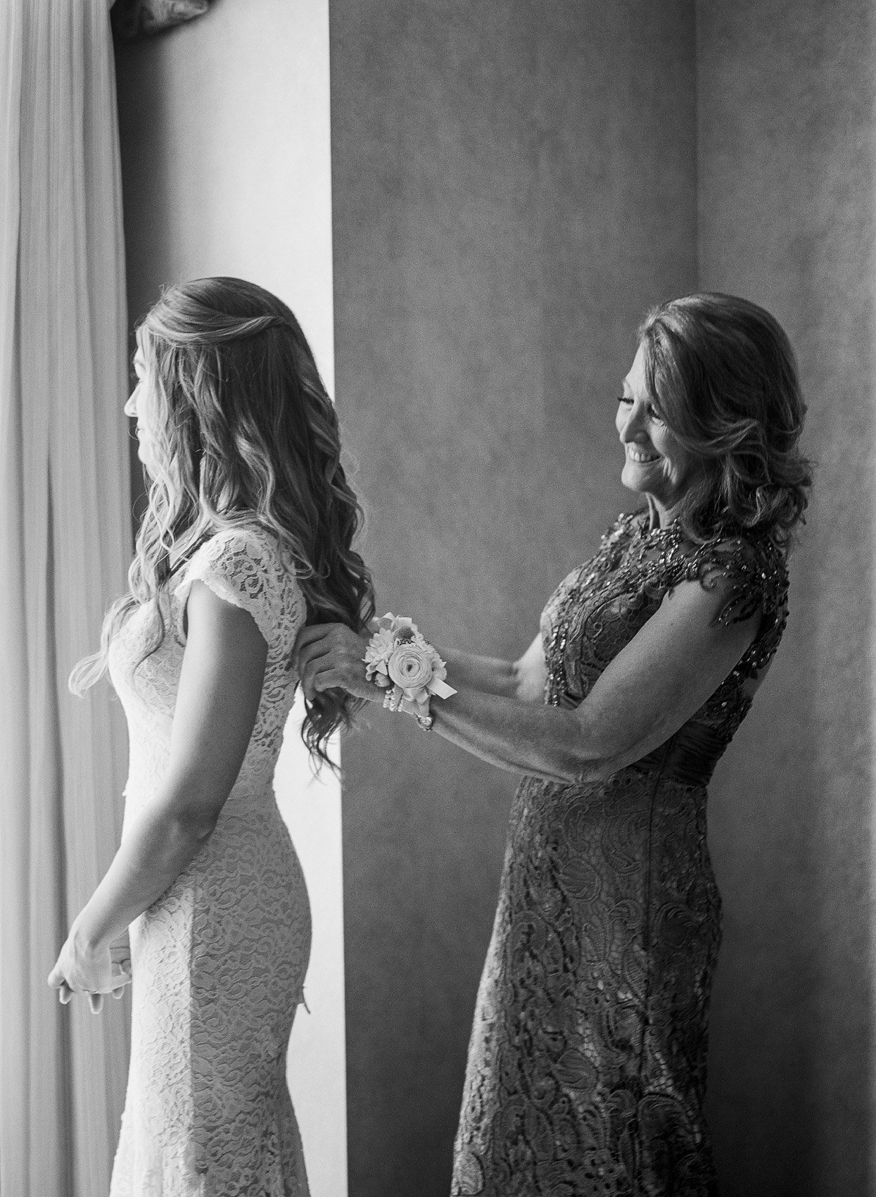 Mother of the bride and bride getting ready photo