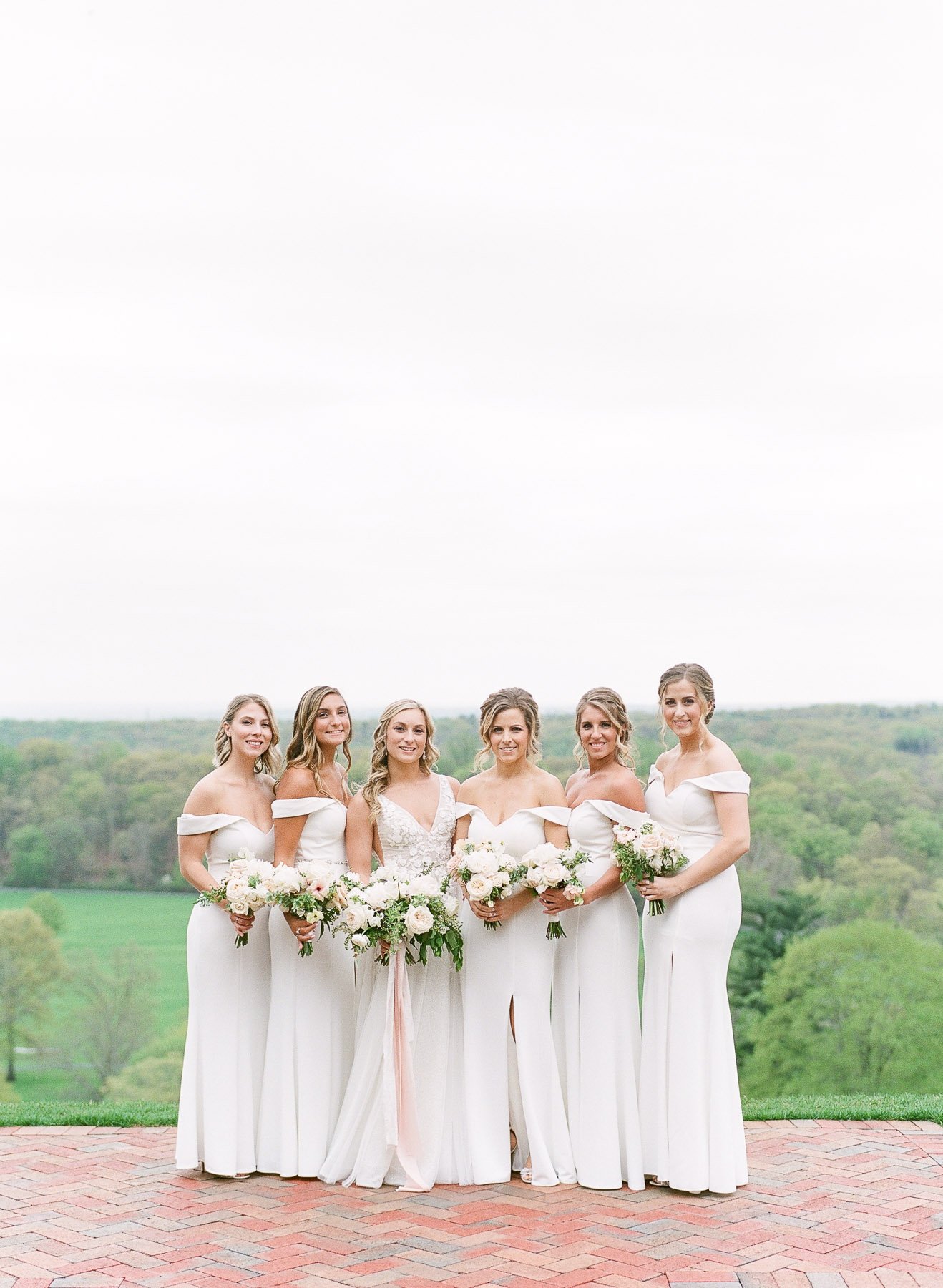 Bridesmaids in white dresses at NJ wedding at Natirar Mansion