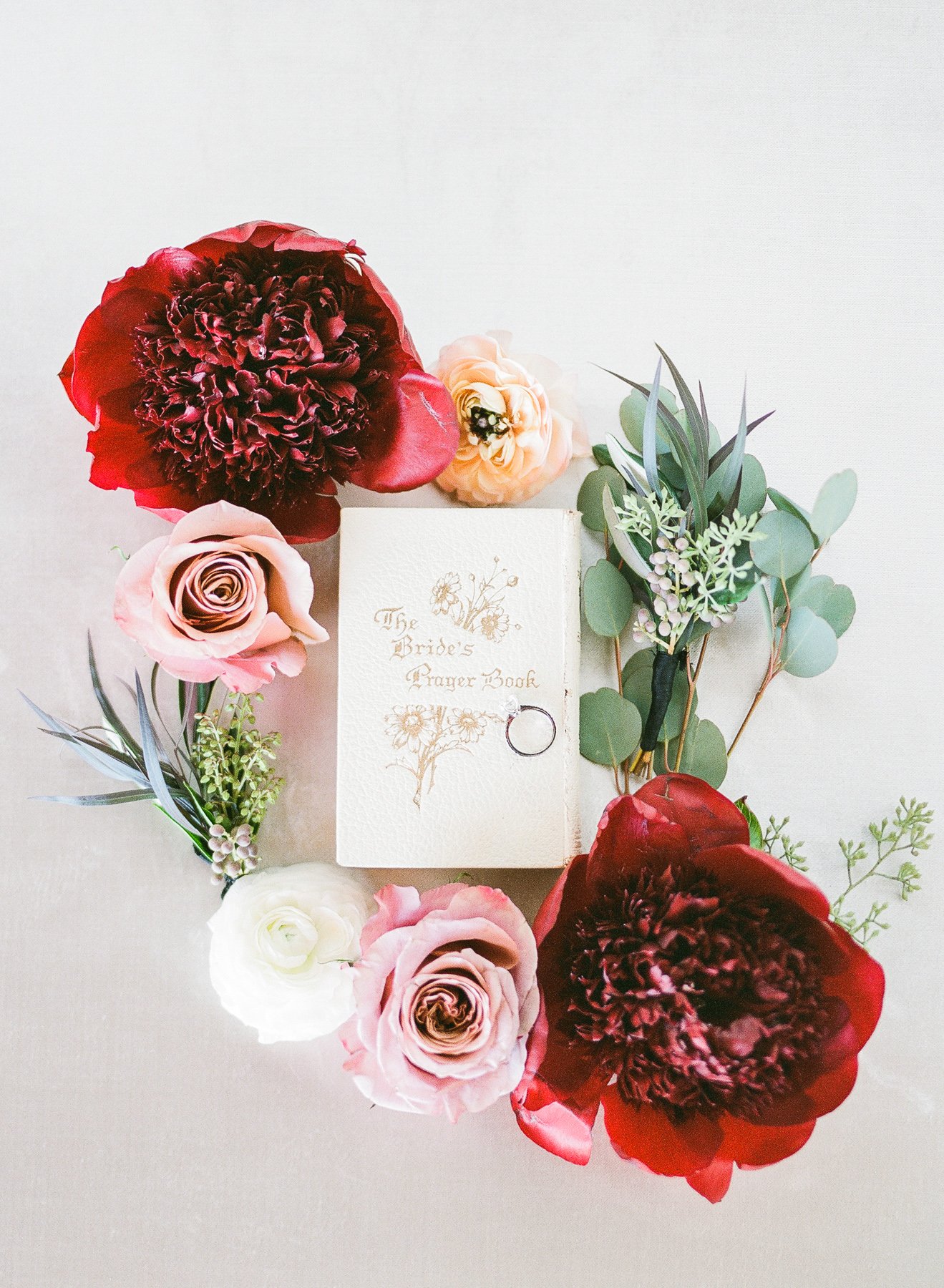 Beautiful styling of wedding details with Grandmother's prayer book