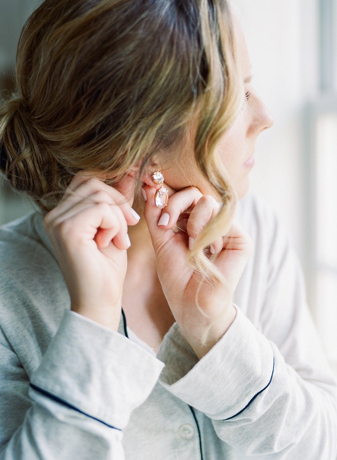 Bride putting on earrings at NJ Wedding Venue