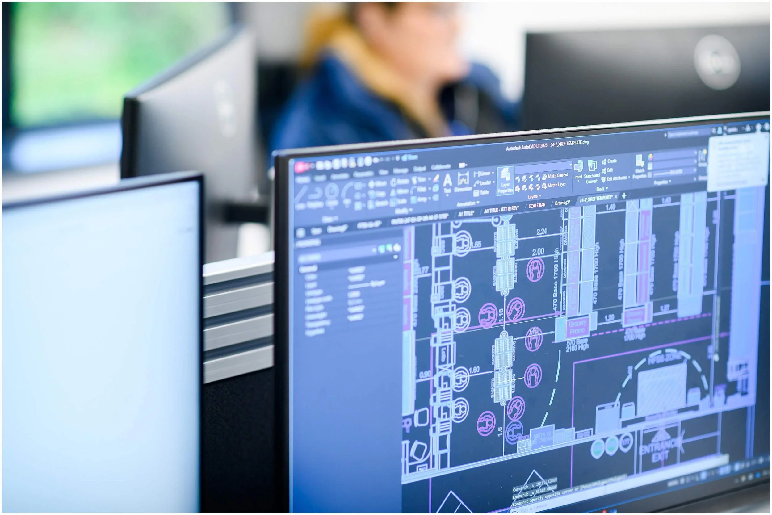 Close-up of AutoCAD technical drawing displayed on a computer monitor in an office