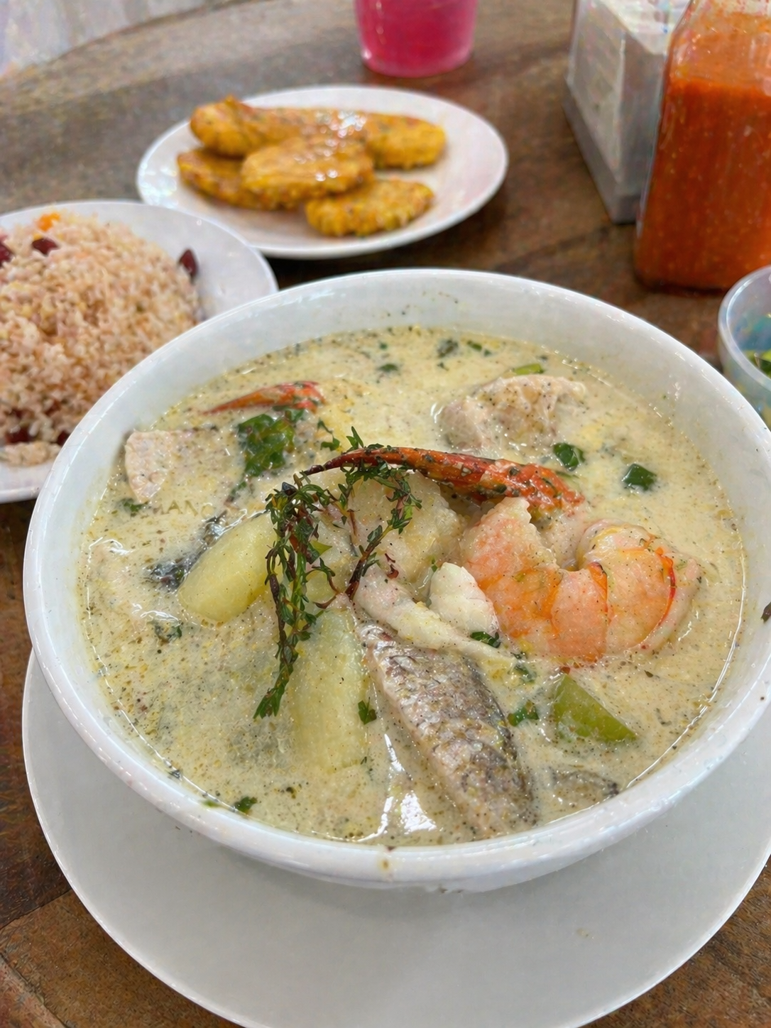 A bowl of Rondon seafood soup with shrimp, fish, and root vegetables in coconut milk broth served in Puerto Limón, Costa Rica.