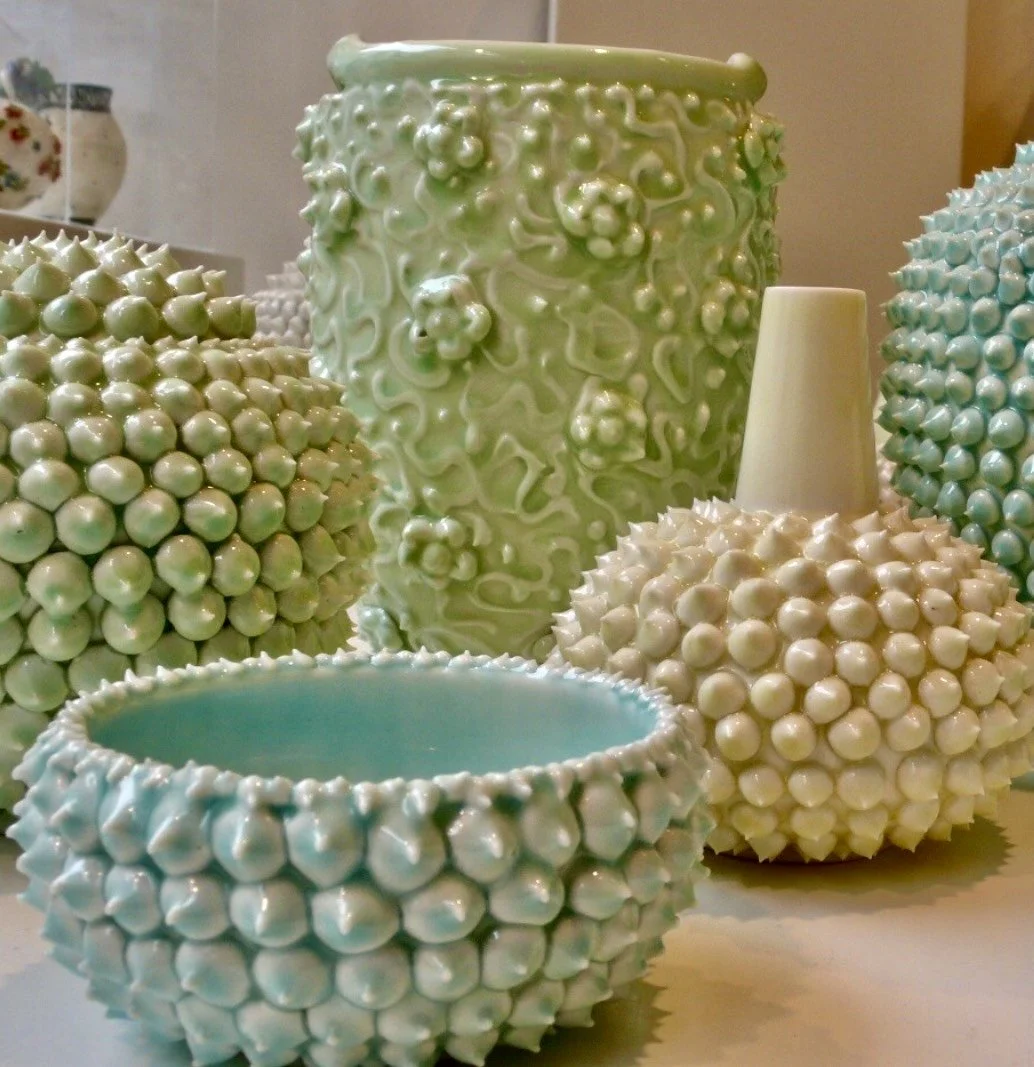 Handcrafted ceramic vases and bowls with textured glaze, artisan pottery decor