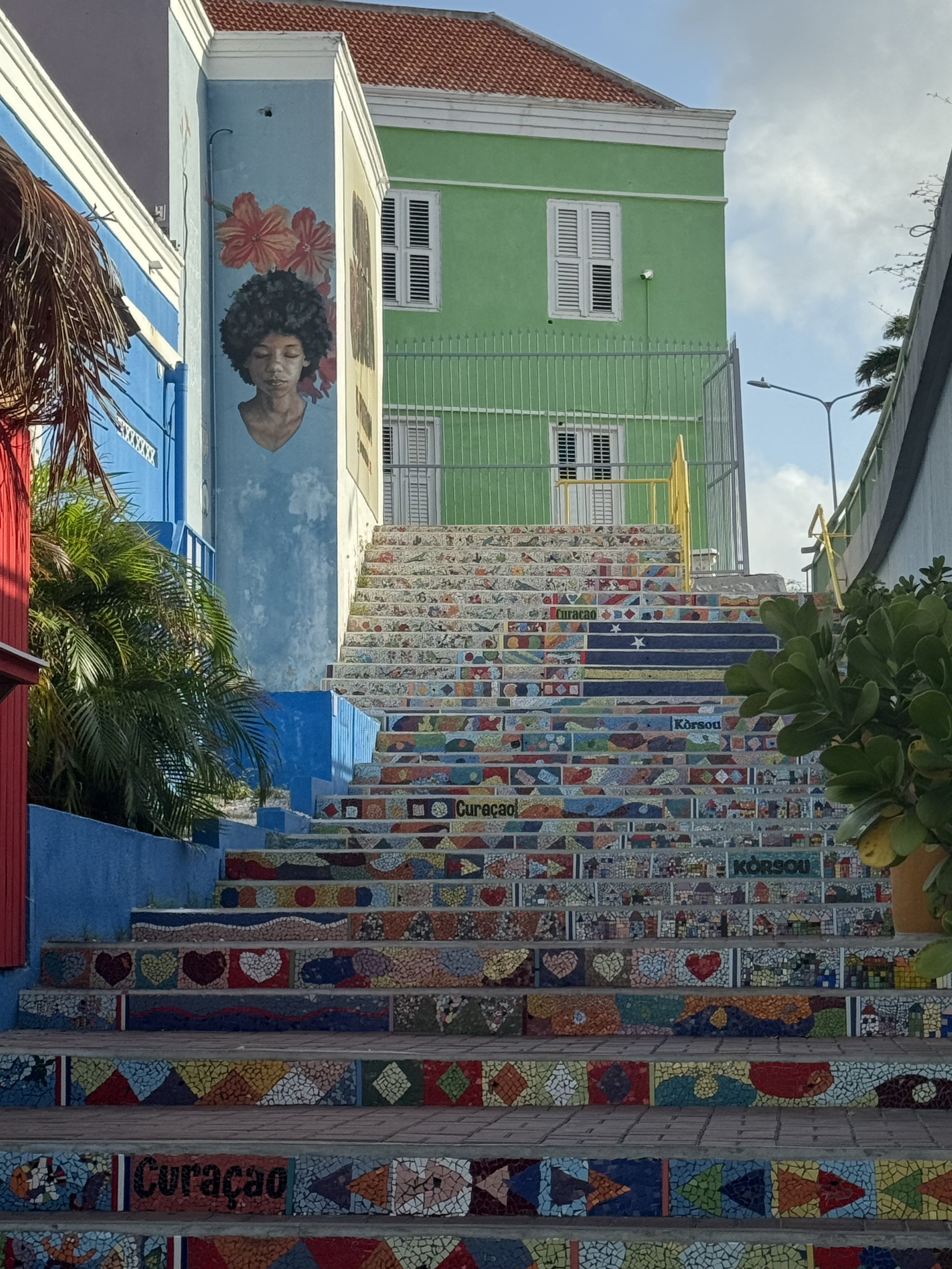 Colorful buildings and mosaic steps in Curacao.