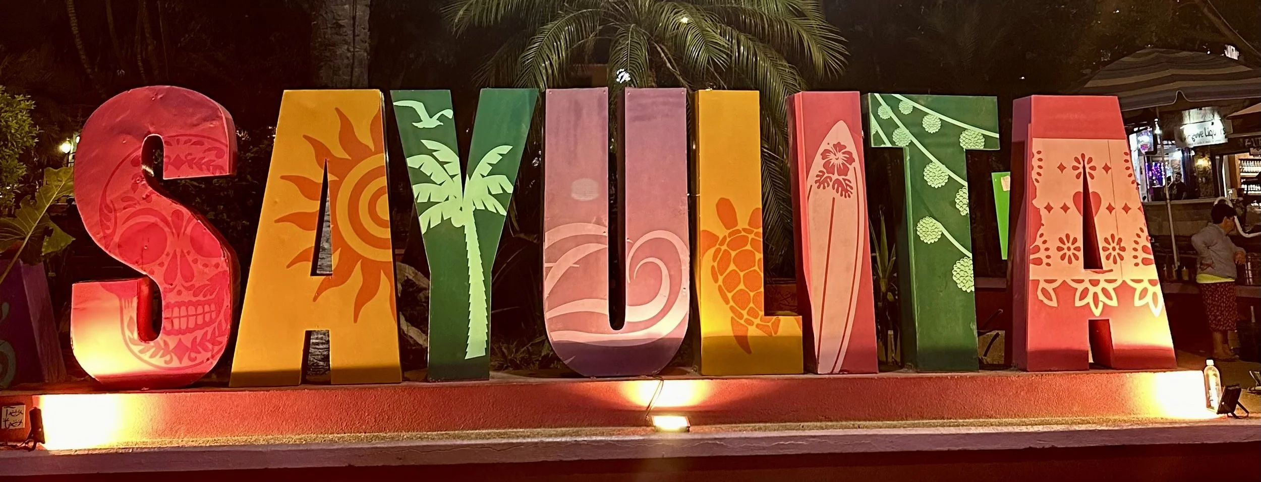 Colorful Sayulita town sign at night in Sayulita, Mexico.